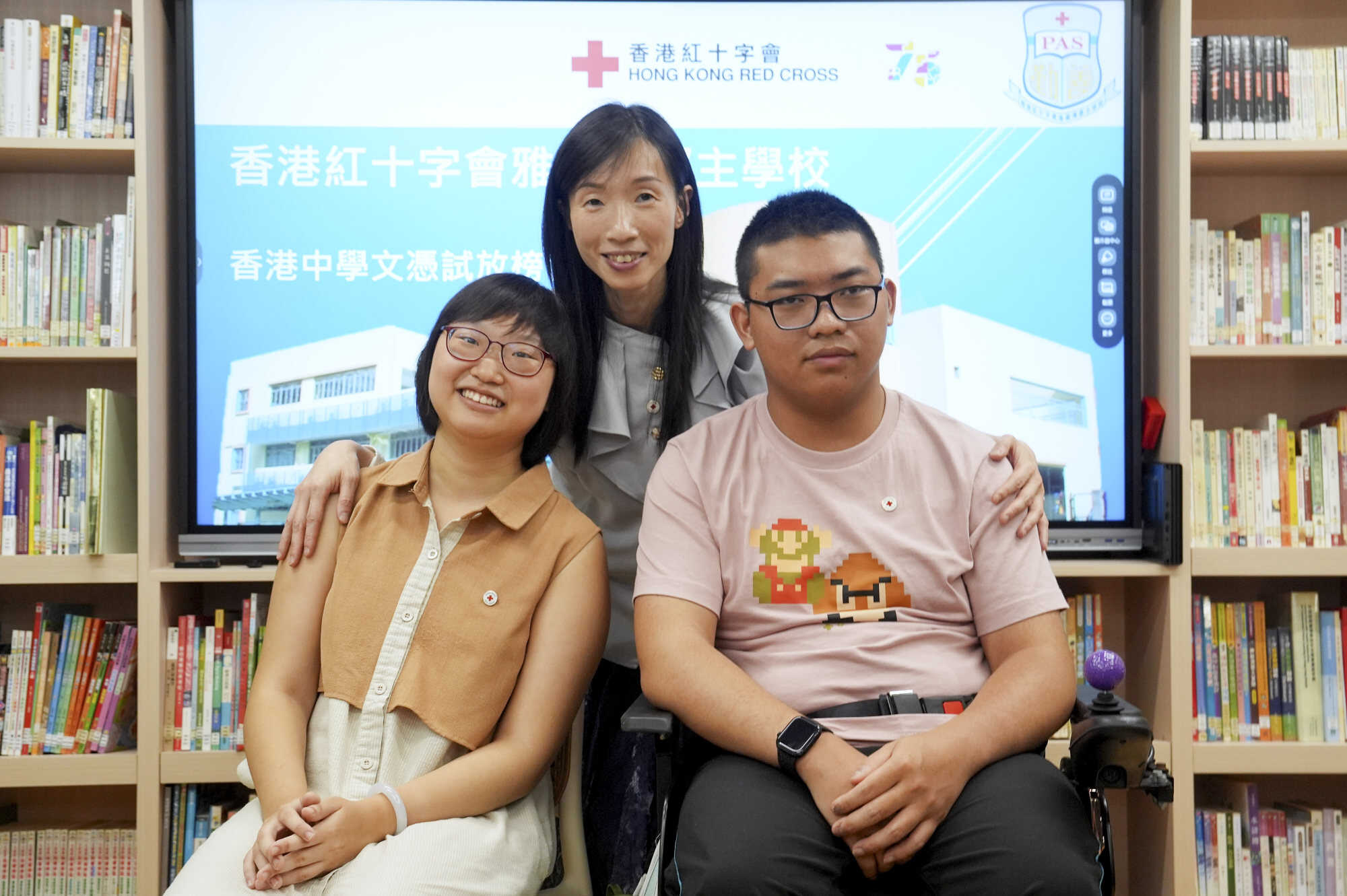 Chen Ngai-lam and Yan Kit-ho pose with Vien Sing, principal of Hong Kong Red Cross Princess Alexandra School. Photo: Elson Li
