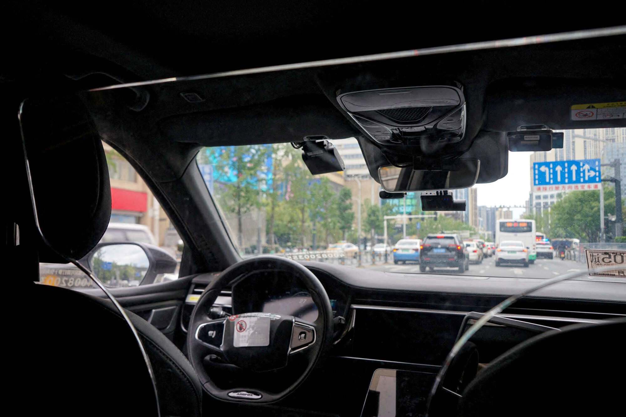 A driverless car by Apollo Go, Baidu’s robotaxi service, drives on a road in Wuhan, Hubei province, China. Photo: Reuters