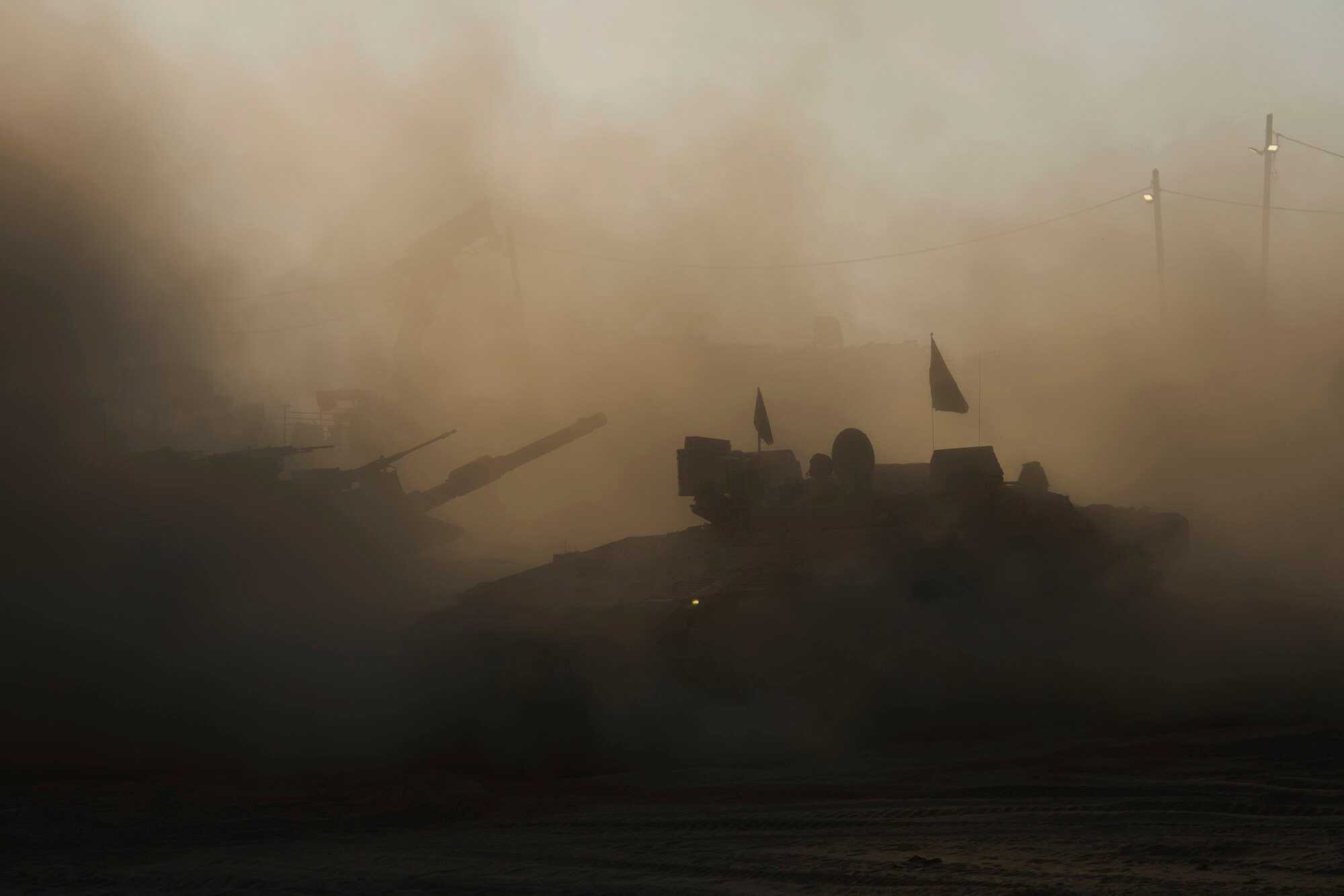 Israeli military APC vehicles at a gathering point near the Gaza Strip. Photo: AP
