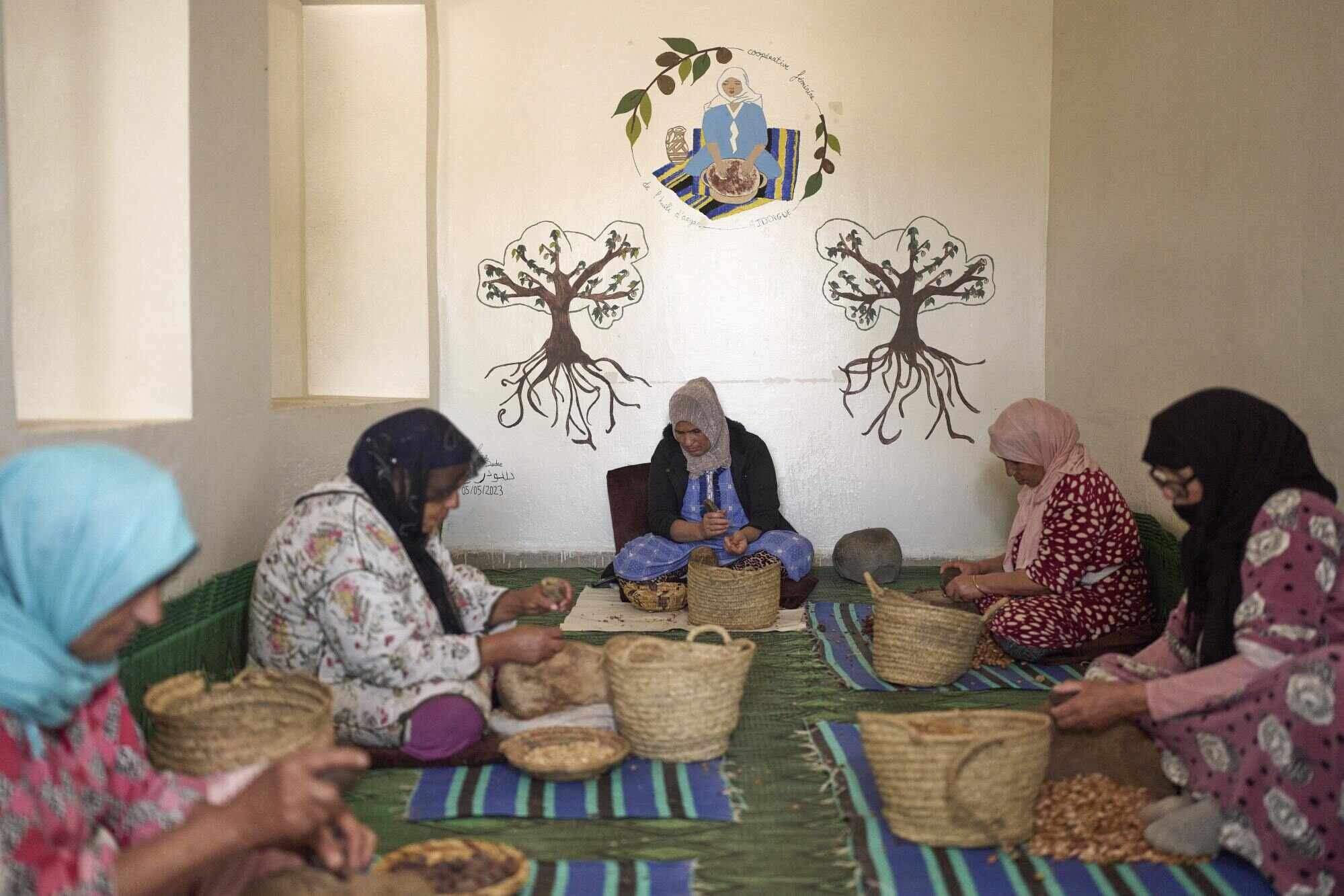 The women who peel, crack and press argan for oil at hundreds of co-operatives say they see little of the profit. Photo: AP
