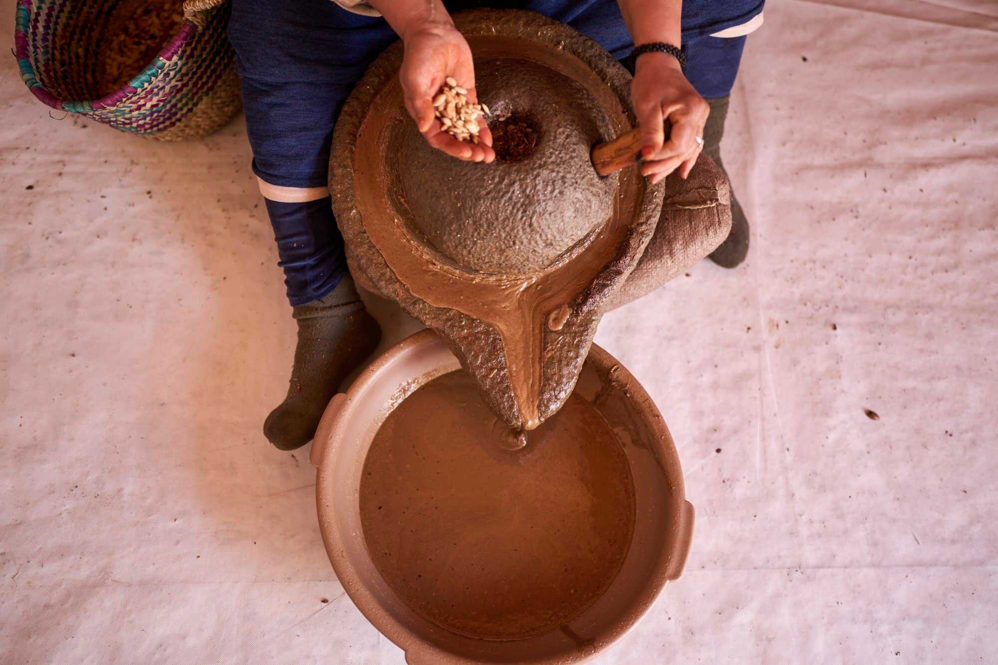 A woman in the process of extracting argan oil at a cooperative in Essaouira, Morocco. Photo: AP
