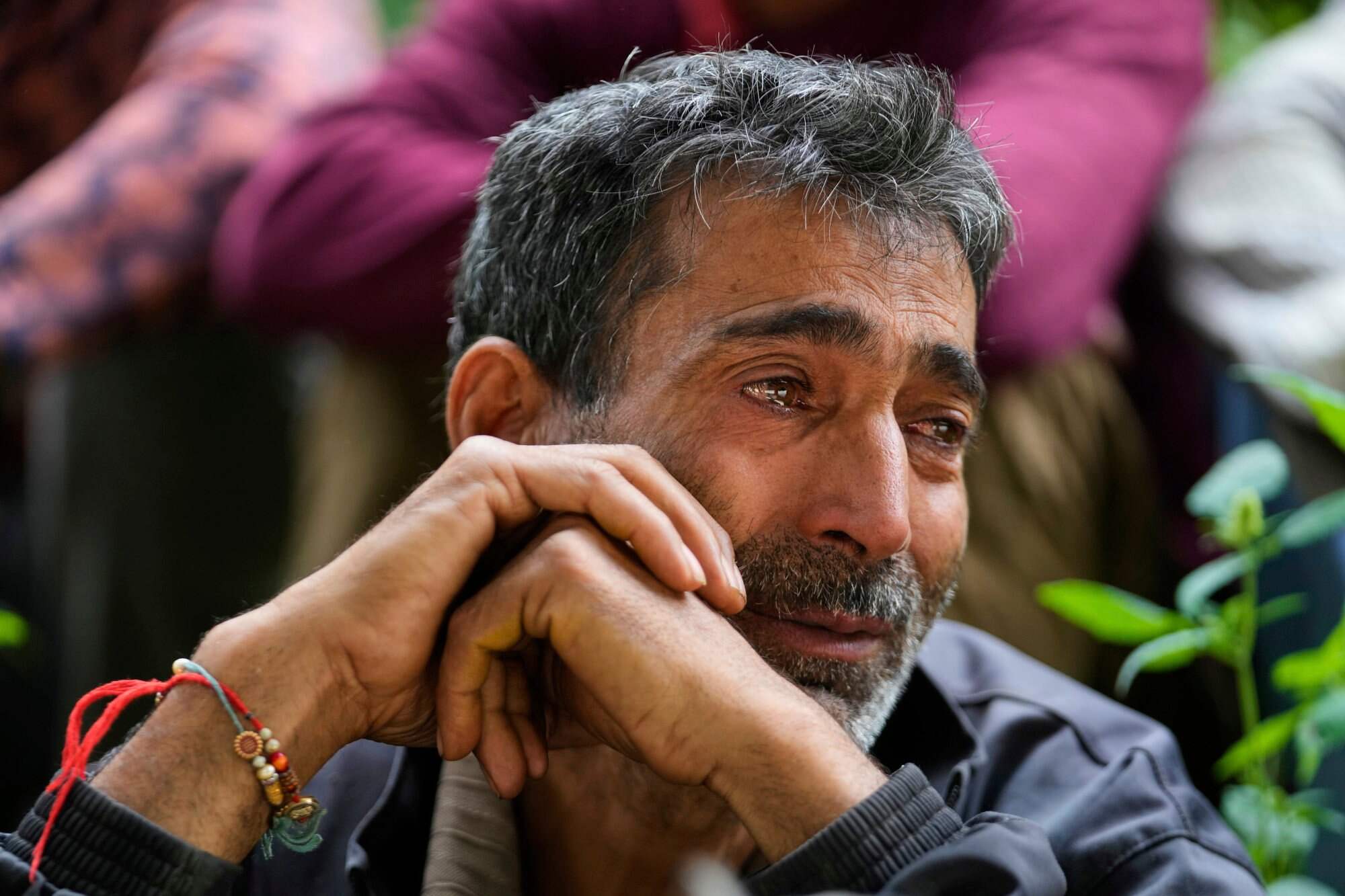 Hari Chand mourns his wife, who died during flash floods in Chositi village, in Kishtwar district, Indian-administered Kashmir. Photo: AP