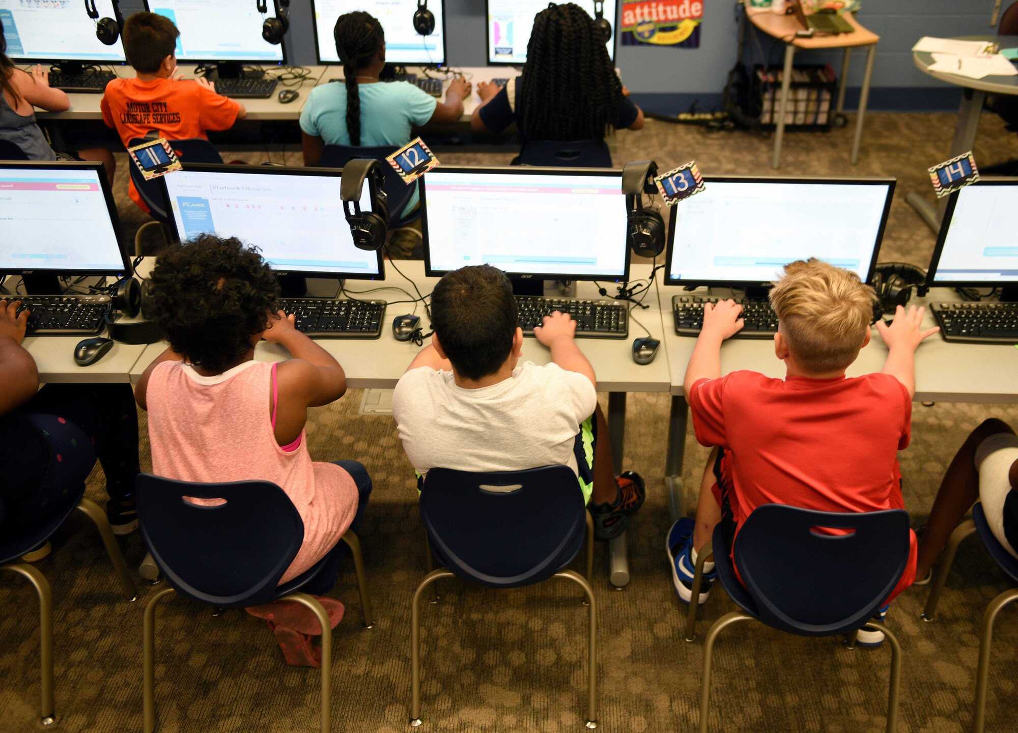 Children sit at computer stations in a classroom in Detroit, United States. Photo: TNS