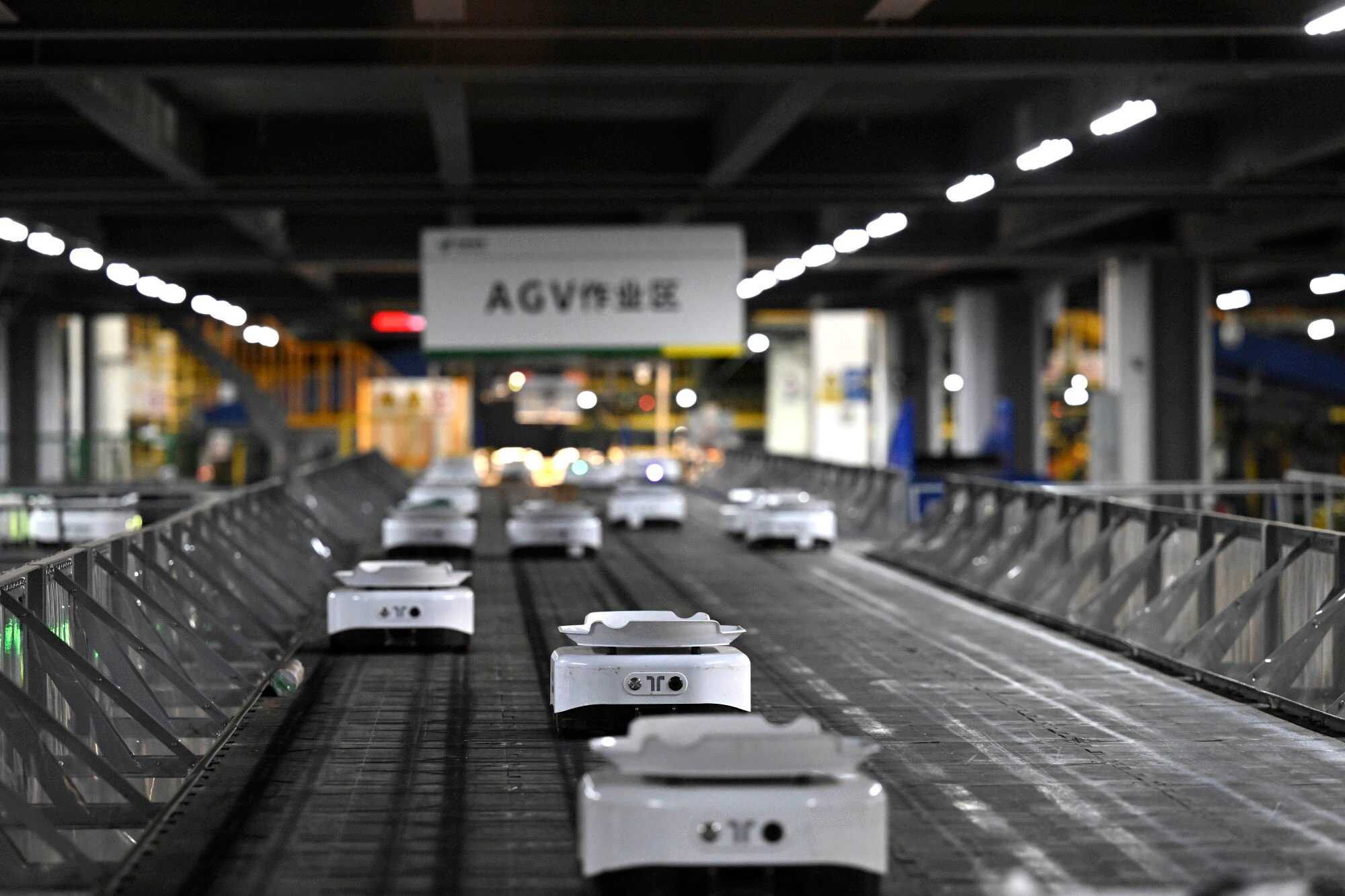 Smart sorting robots work at a postal zone’s central station. Photo: Xinhua