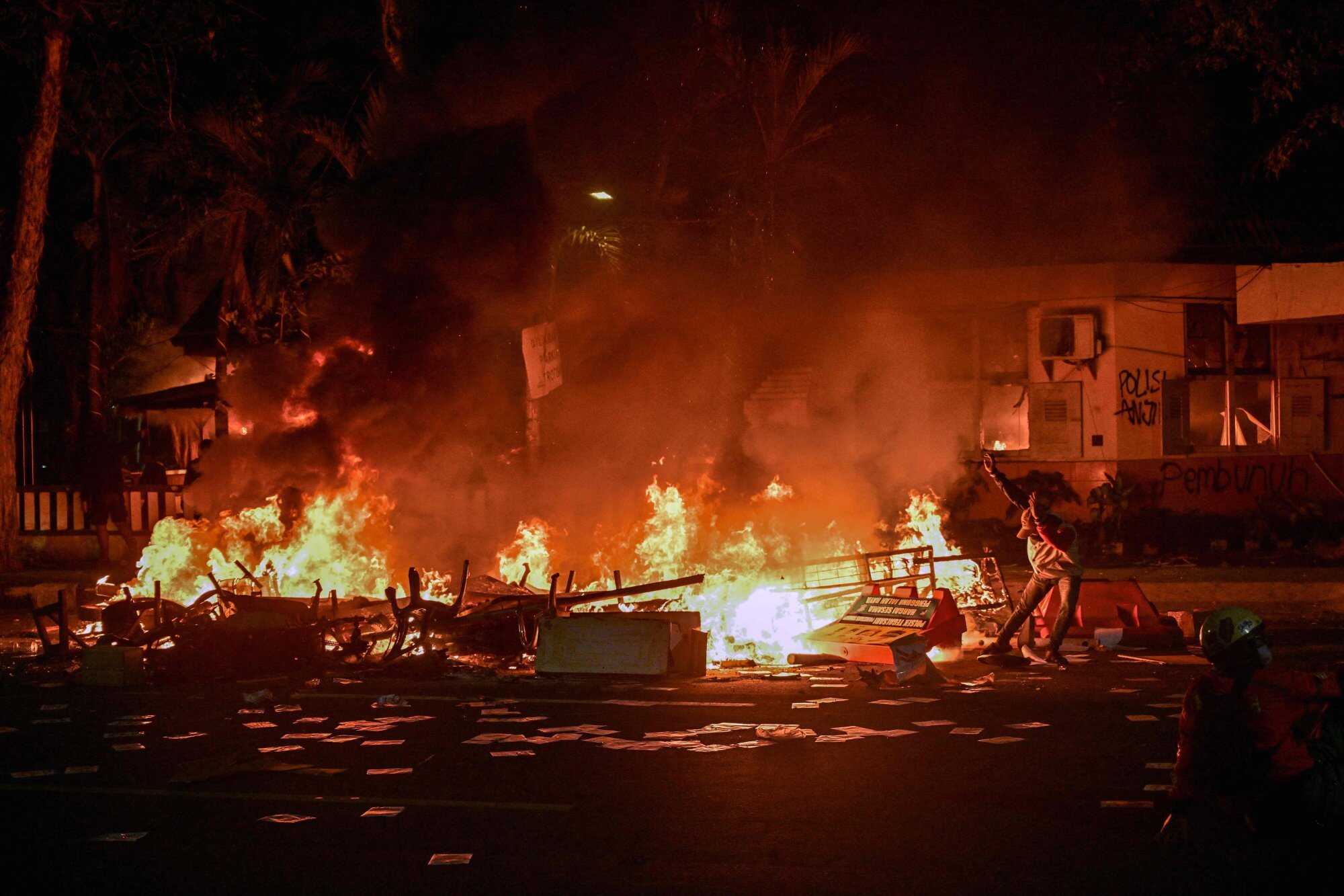 A police headquarters that was set on fire and looted during a demonstration in Surabaya. Photo: AFP