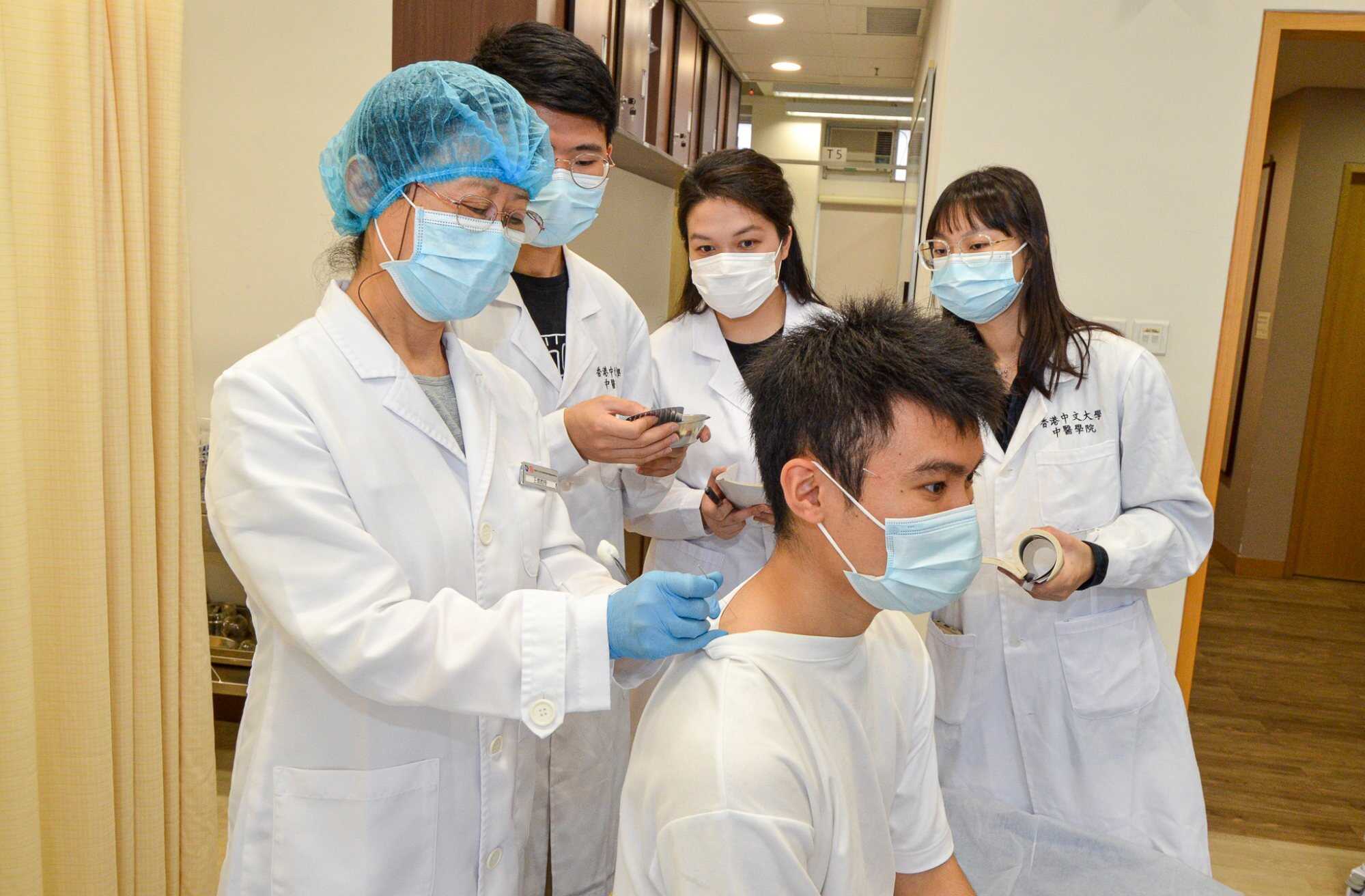 Students in CUHK’s Chinese medicine programme learn about acupuncture. Photo: Handout