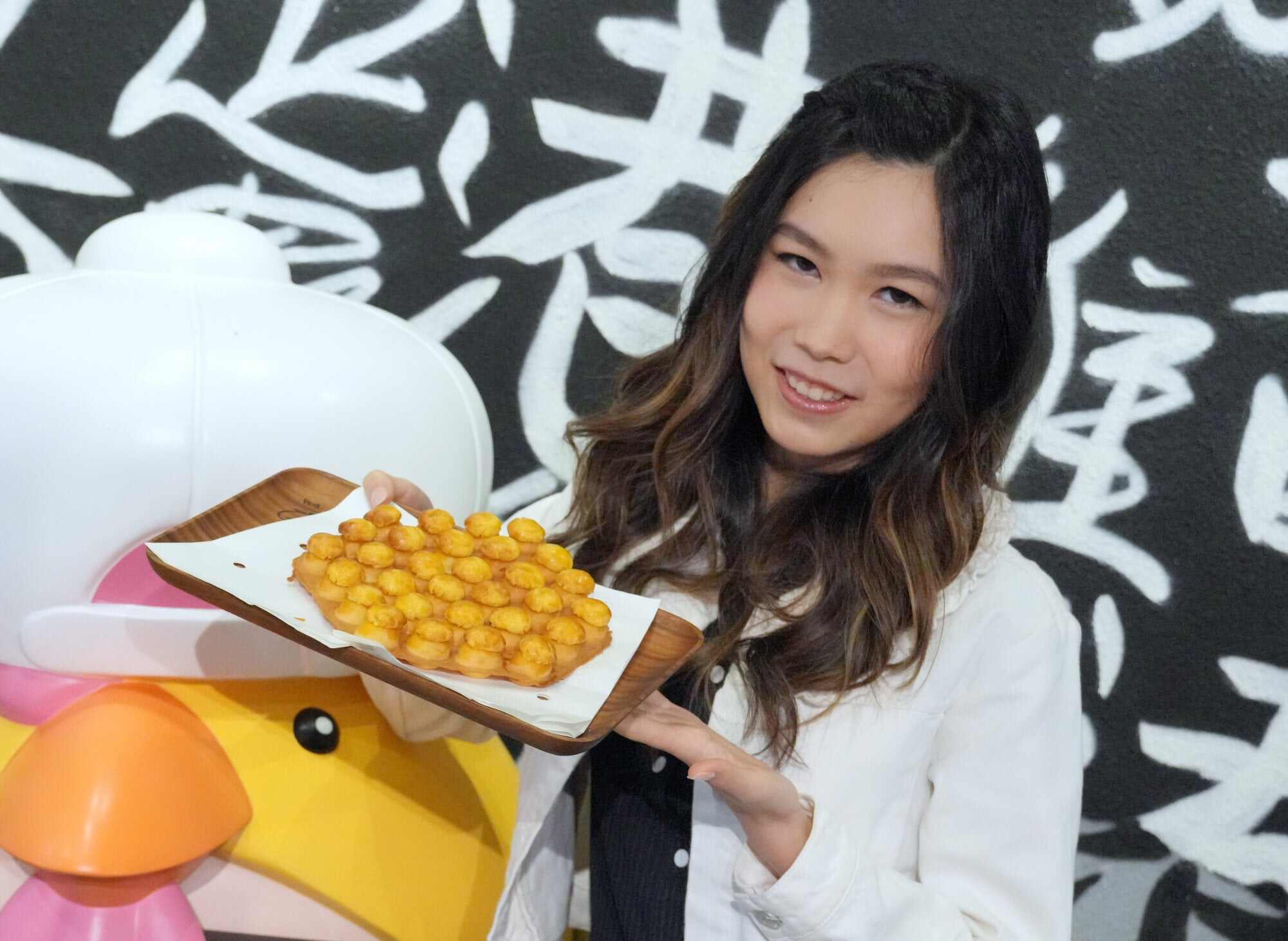 Each egg waffle puff has a pineapple bun topping. Photo: May Tse