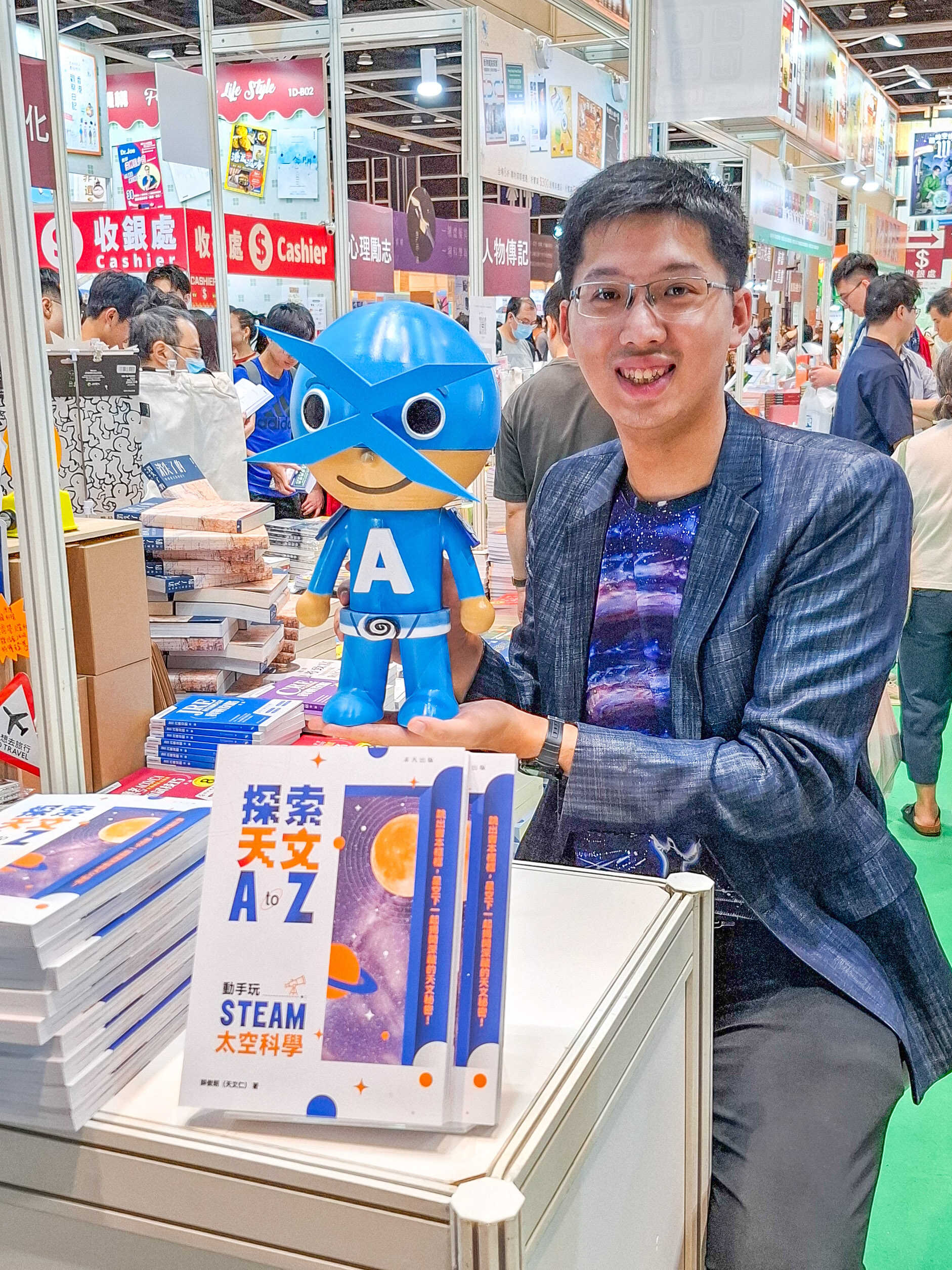 Exodus Sit and his second book, ‘Explore Astronomy A to Z: Get hands-on with STEAM Space Science’, at this year’s Hong Kong Book Fair. Photo: Handout