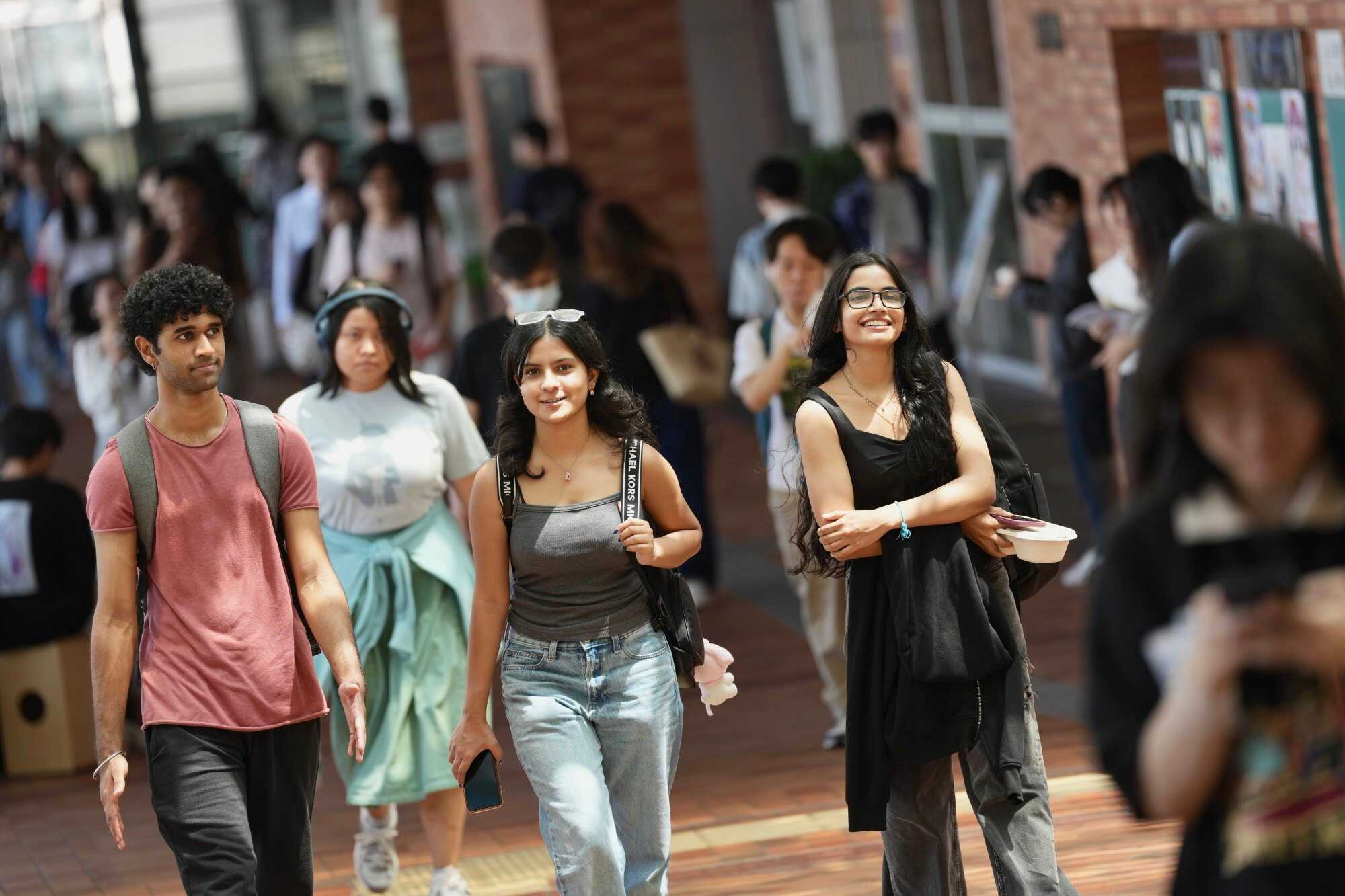 Students at the University of Hong Kong campus in Pok Fu Lam. The government will also increase the enrolment ceiling for self-financing non-local students at public universities. Photo: Karma Lo