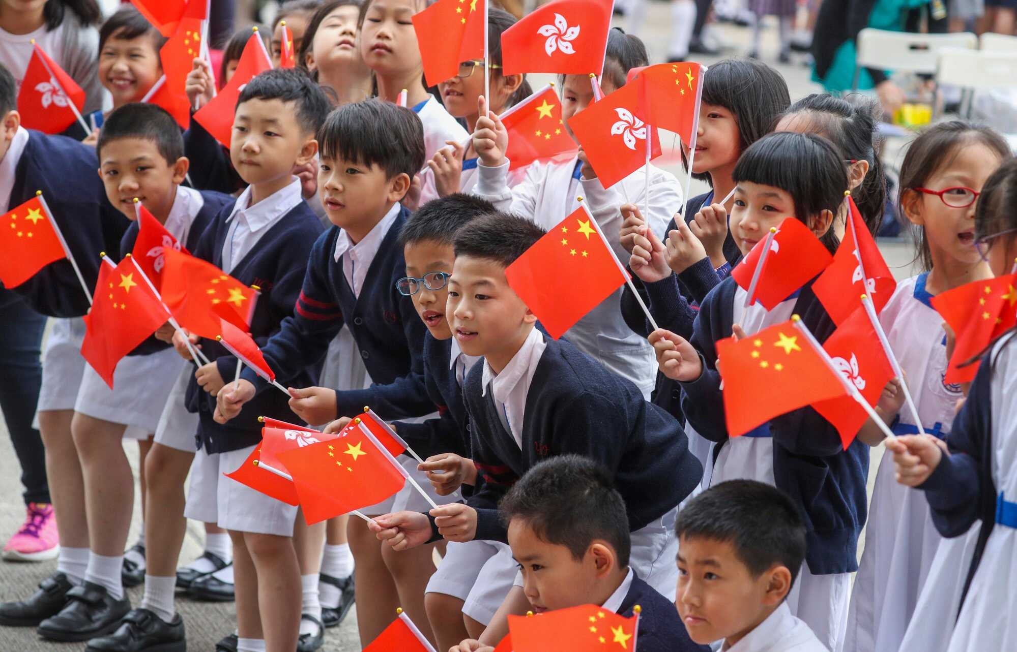 Students attend a flag-raising ceremony in Wan Chai that marked the 100th anniversary of the May Fourth Movement. Photo: Winson Wong
