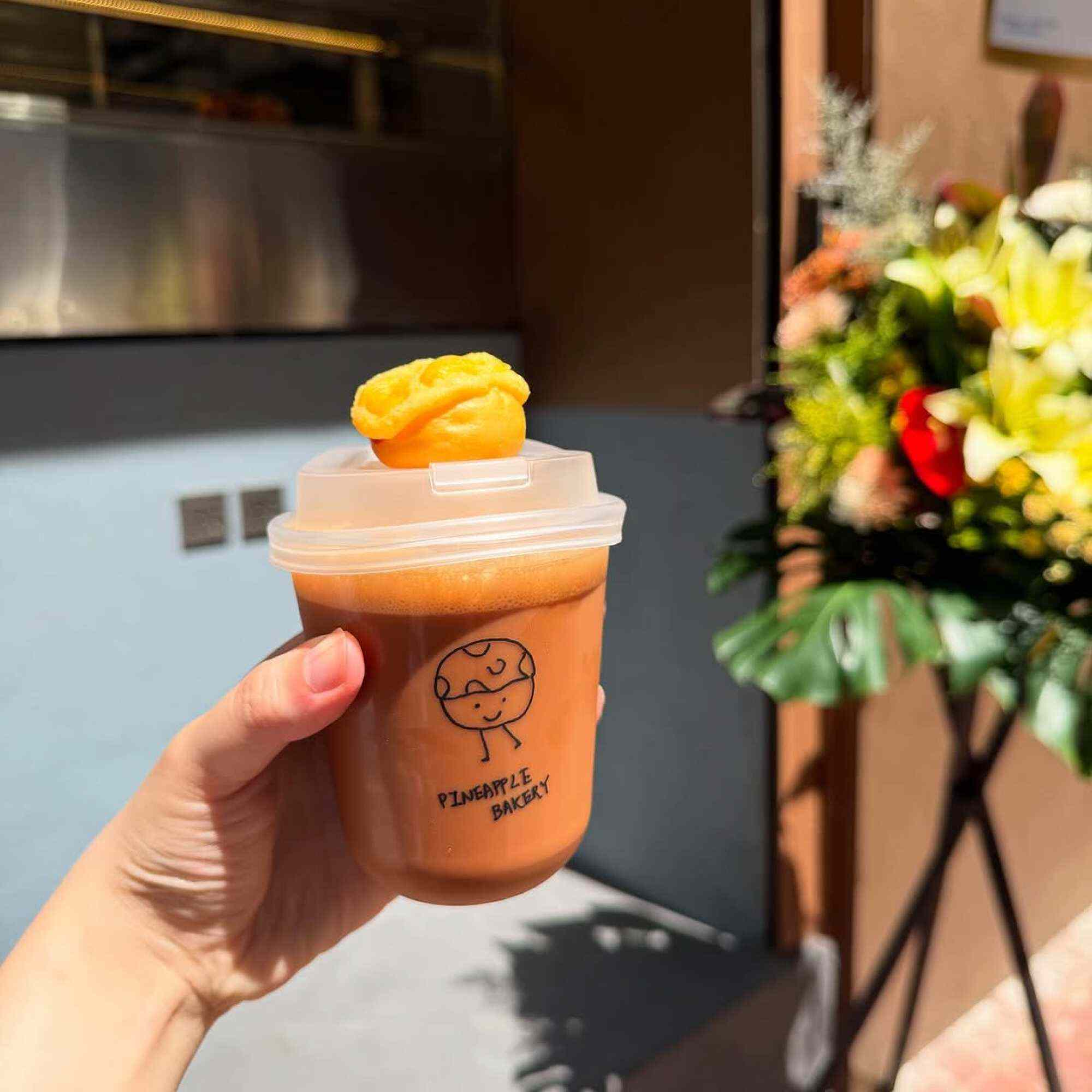 Nitro-brewed Hong Kong-style milk tea with a mini pineapple bun at Pineapple Bakery. Photo: Instagram/pineapplebakeryhk
