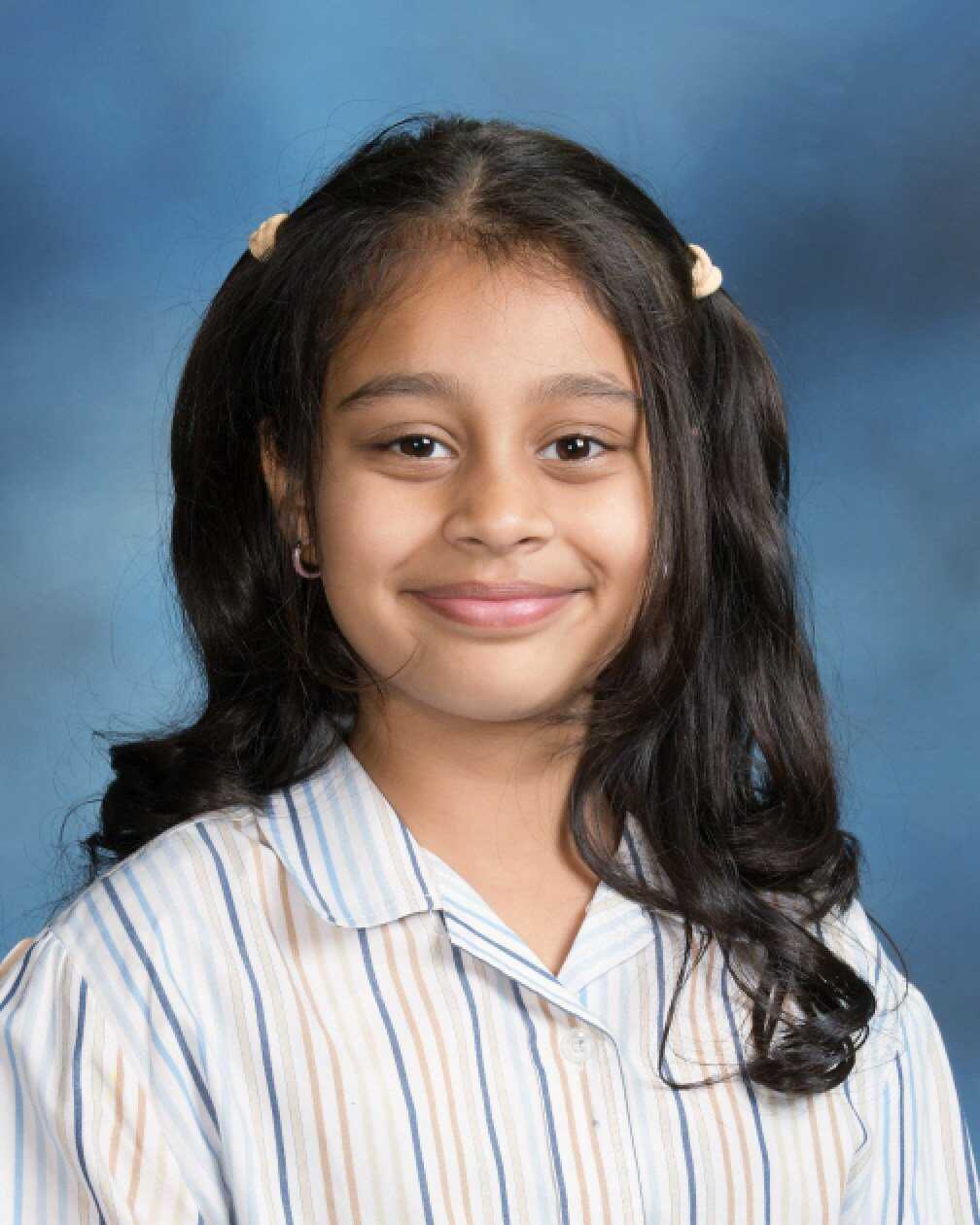Mishka Shah, a student at Kowloon Junior School, shares an Indian cultural tradition she practises during Diwali. Photo: Handout