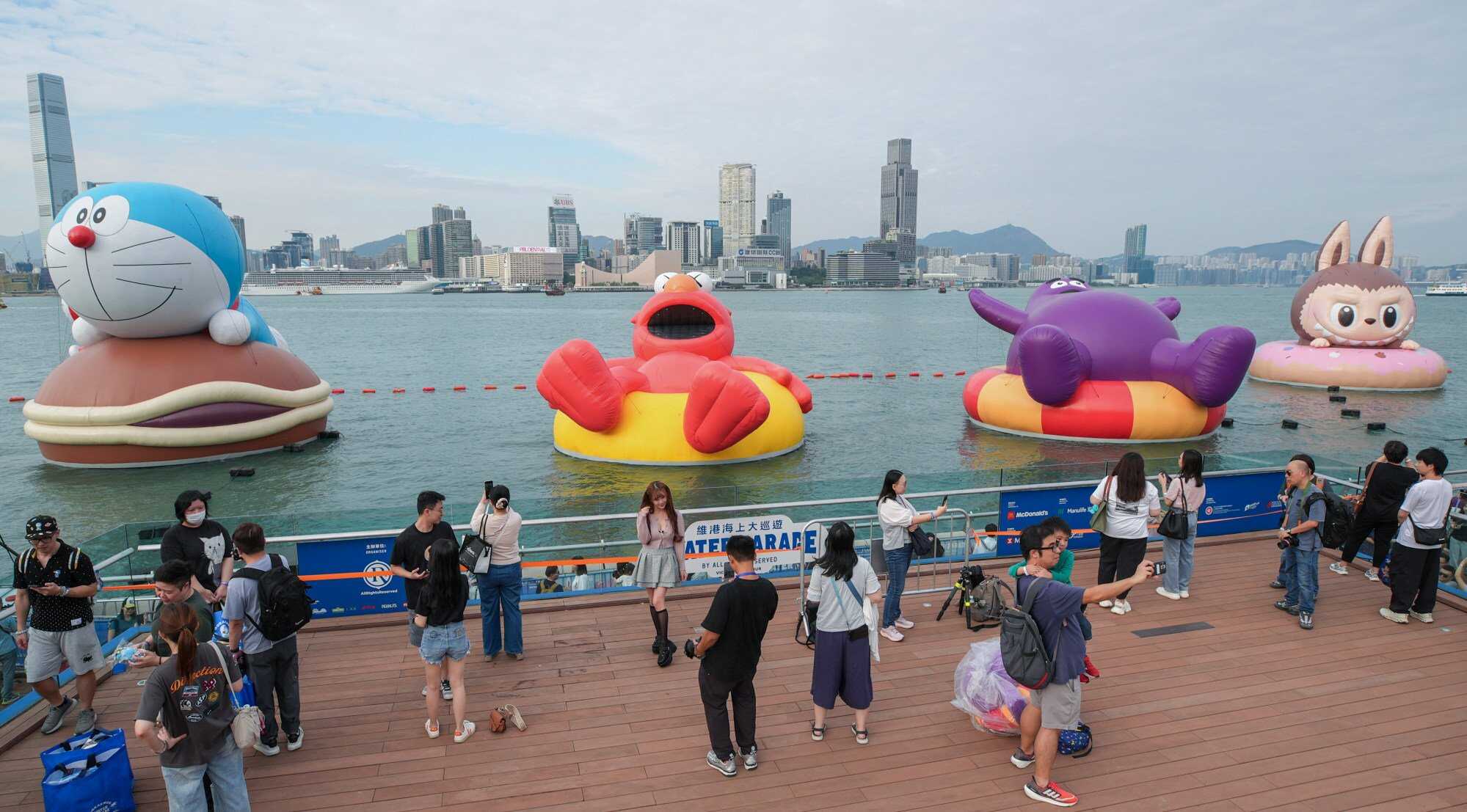 Each character sat on a float, some of which were specially designed to match. Labubu clung to a pink doughnut while Doraemon sat on his favourite food, dorayaki. Photo: Eugene Lee