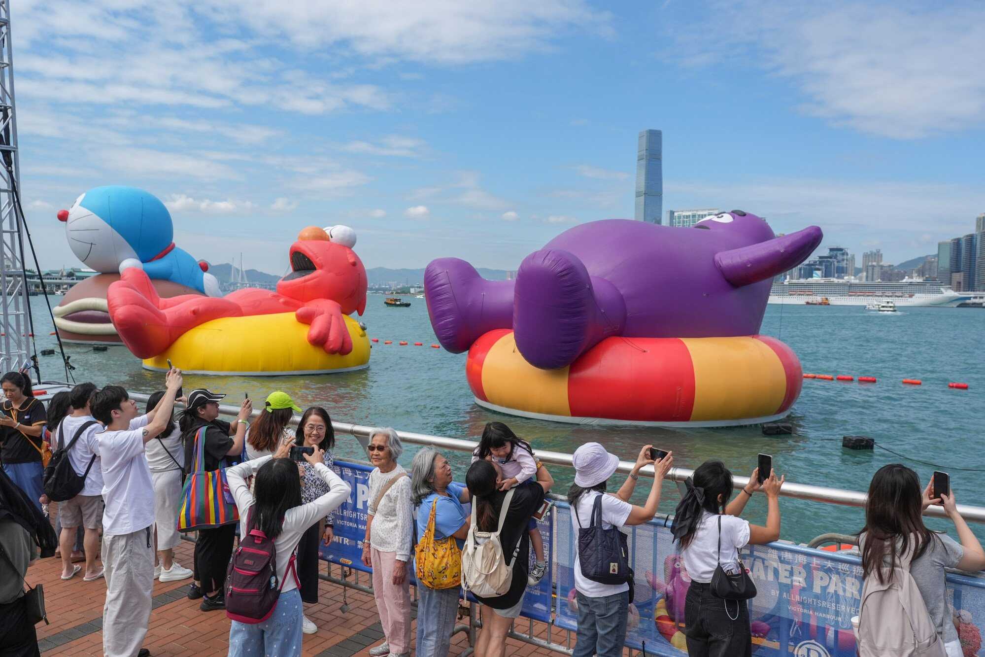 Young and old fans were delighted by the huge inflatables. Photo: Eugene Lee