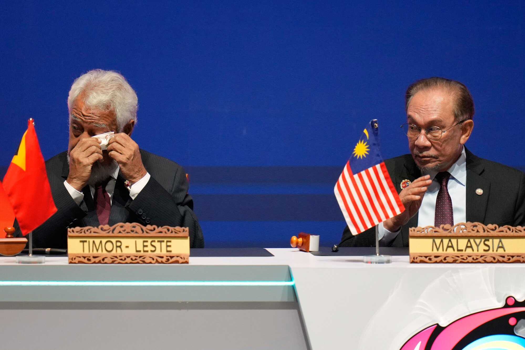 East Timor’s Prime Minister Kay Rala Xanana Gusmao wipes his eyes sitting beside Malaysia’s Prime Minister Anwar Ibrahim. Photo: AP