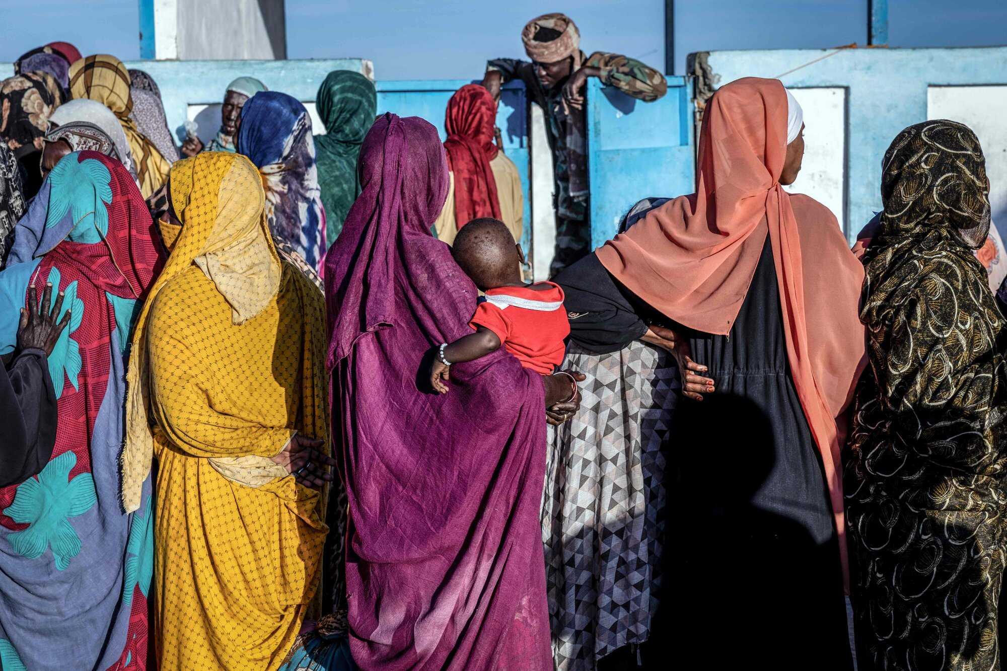 Sudanese refugees wait outside the United Nations High Commissioner for Refugees (UNHCR) registration office in the Tine transit camp in Chad on November 9, 2025. Photo: AFP