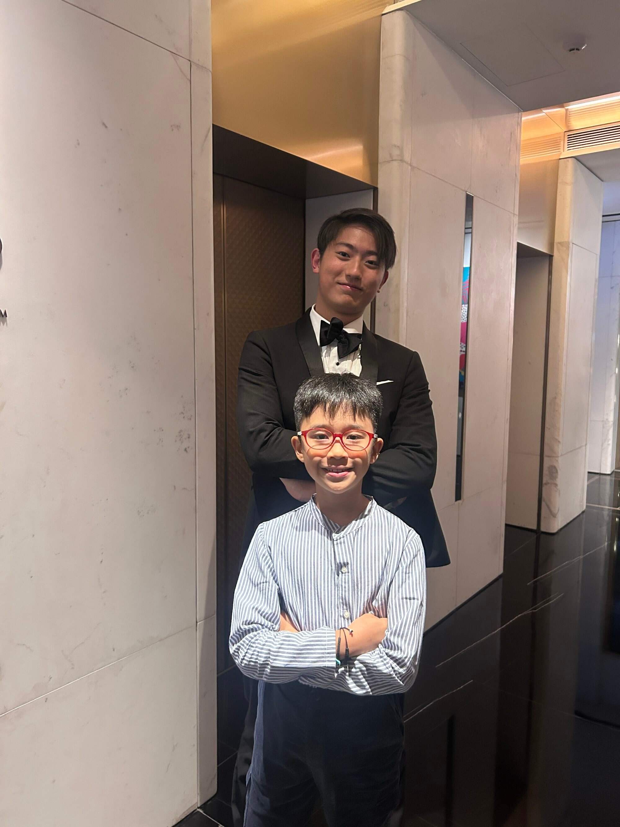 Gabriel Ling (front) poses with a member of The Harvard Krokodiloes, an all-male a cappella group, at an afternoon tea event held in Hong Kong. Photo: Handout