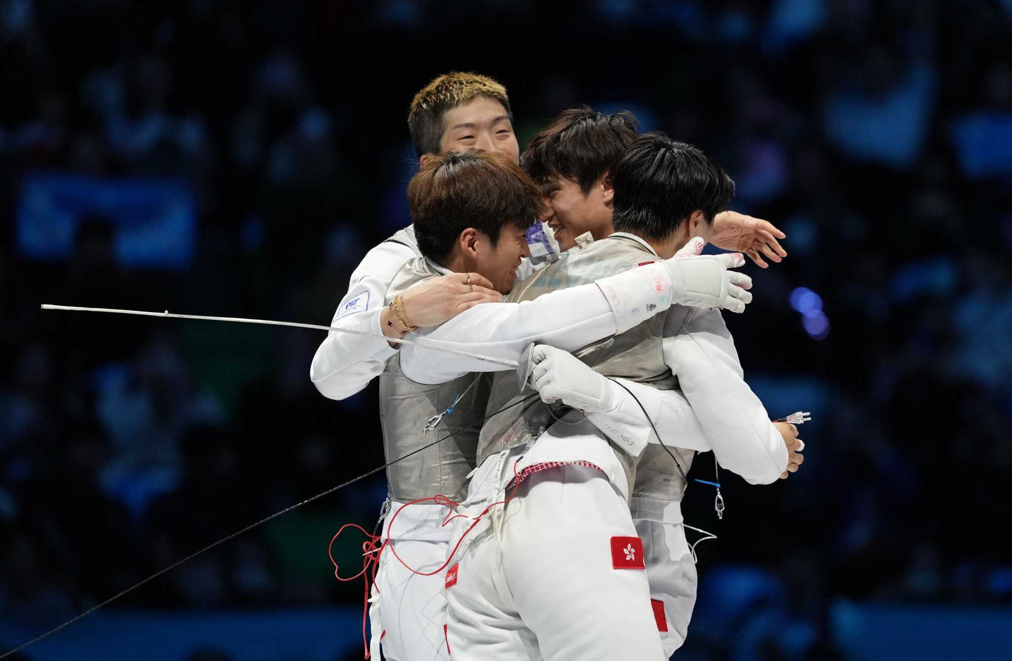 The power of teamwork! Hong Kong beat Fujian to secure the gold at the 15th National Games Men’s team foil competition at Kai Tak Arena. Photo: Elson Li