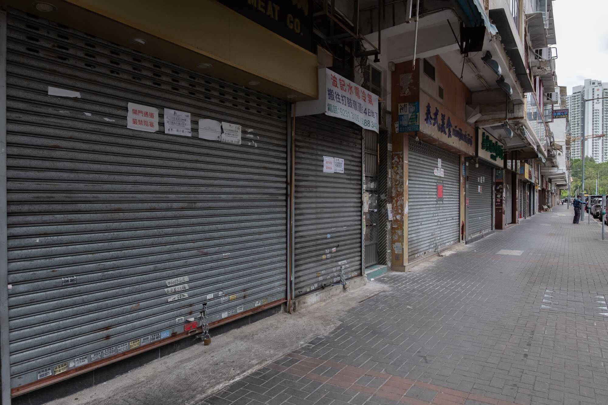 An entire row of closed shops along Nam Kok Road in an area of Kowloon City that had been marked for redevelopment. Photo: Connor Mycroft