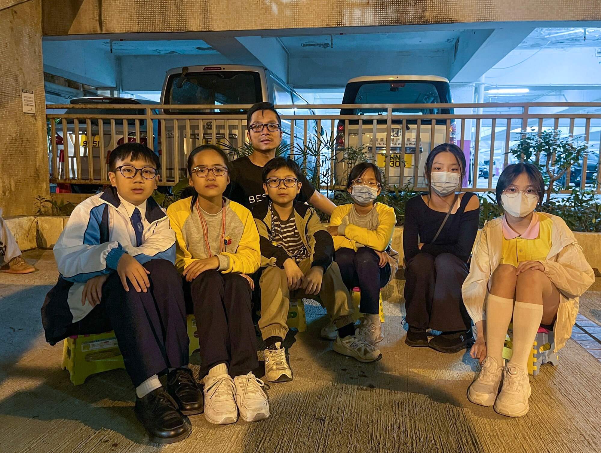 Liam Ng (front row, from left), Rainbow Lam, Leif Ng, Summer Lam, Elena Ho and Summer Chan helped those affected by the fire in Tai Po. Photo: Kelly Fung