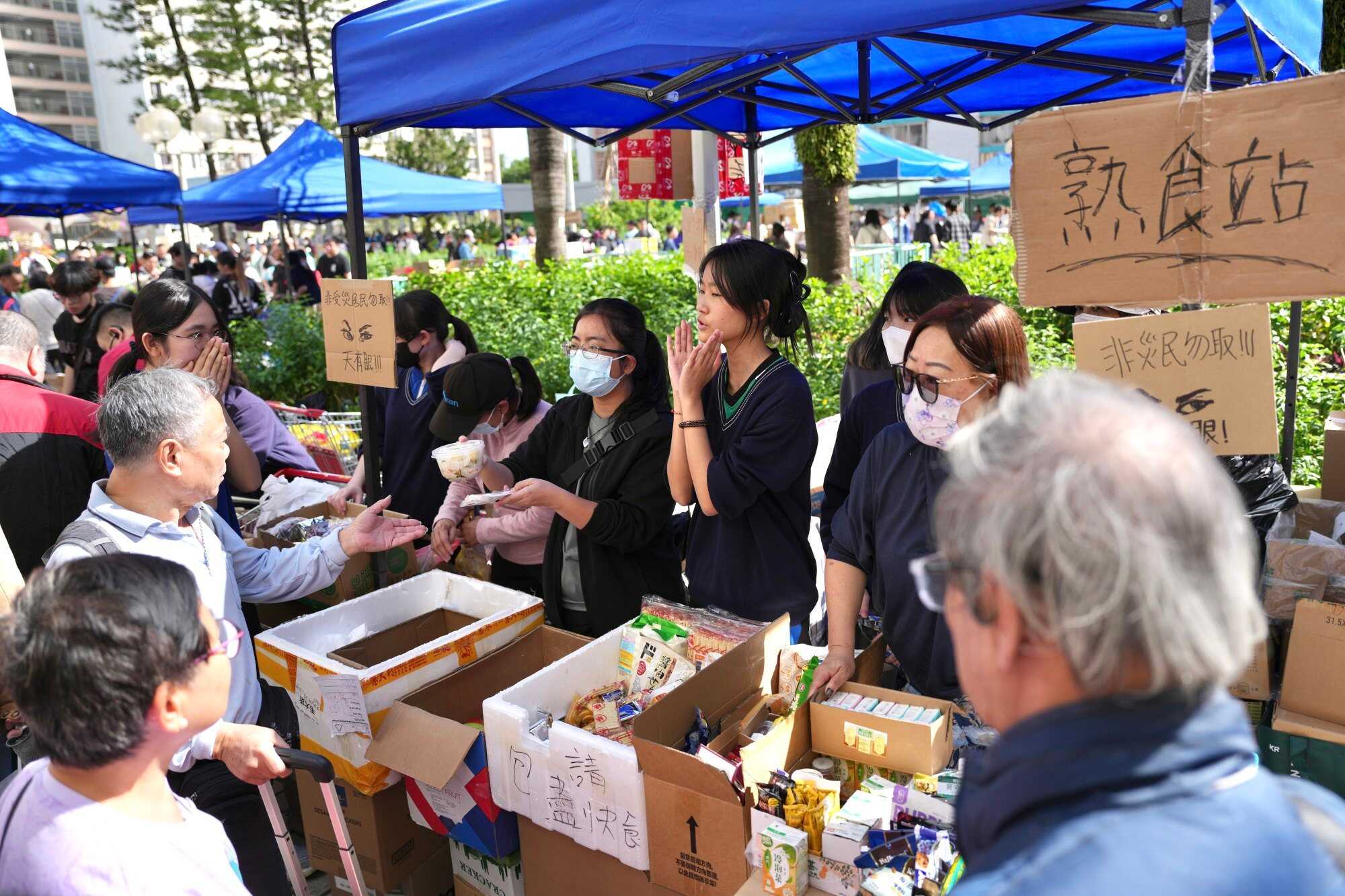 Supply stations are set up on the podium of Kwong Fuk Estate, a public housing complex in Tai Po. Photo: Karma Lo
