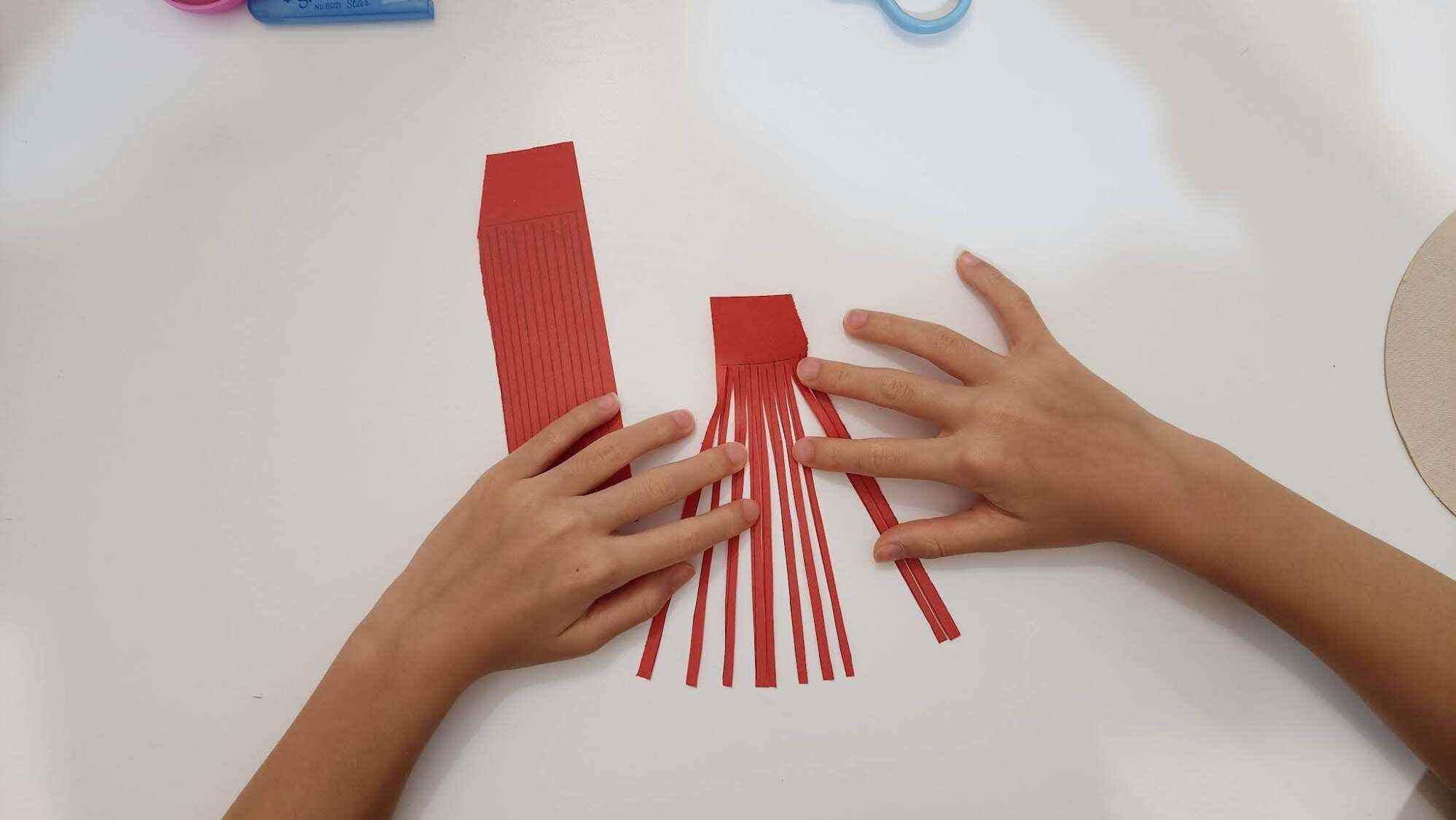 To create the fringe, make sure not to cut all the way to the end. Photo: JEMS Character Academy