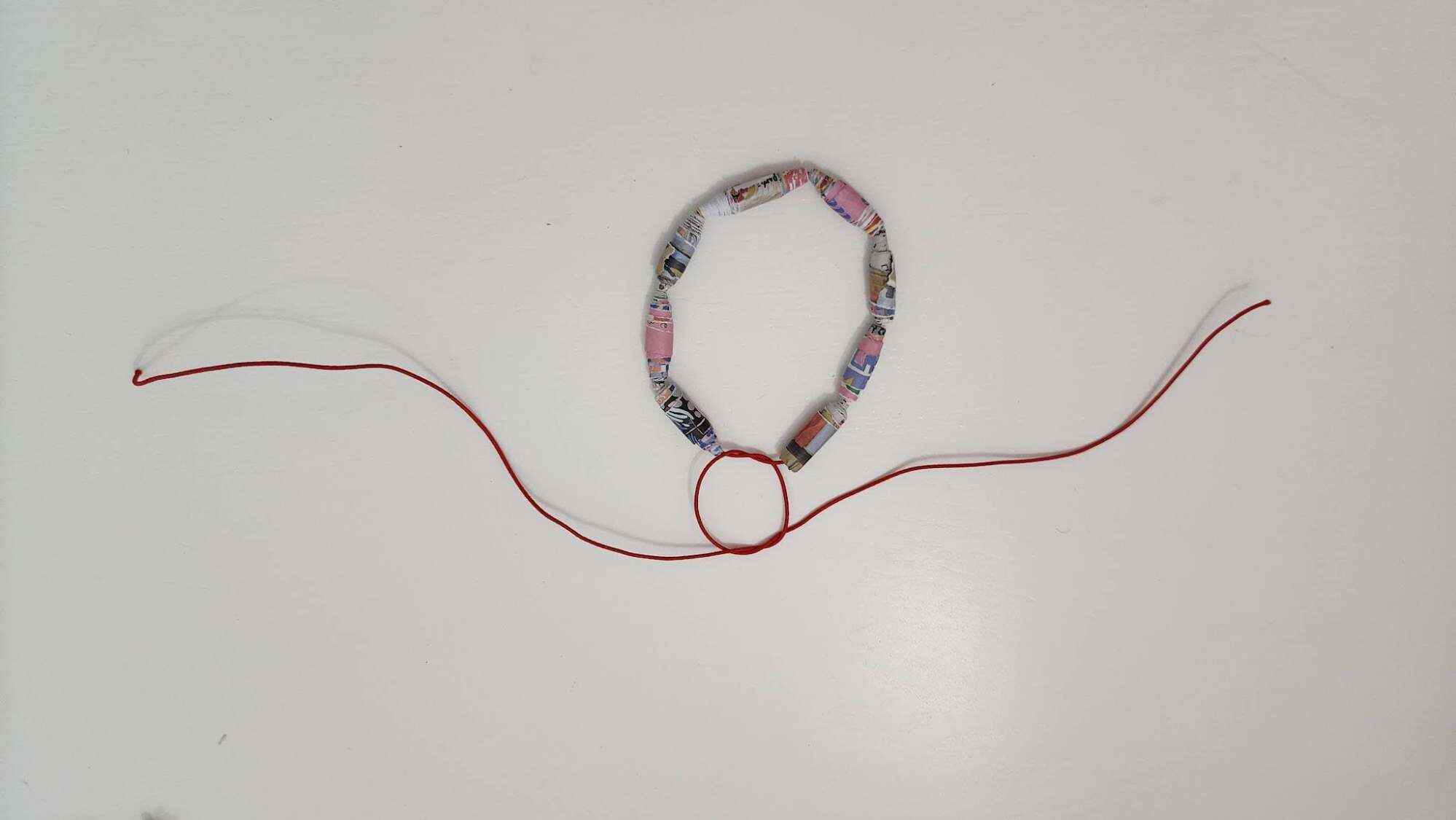Tie a double knot to finish off your ornament. Photo: JEMS Character Academy