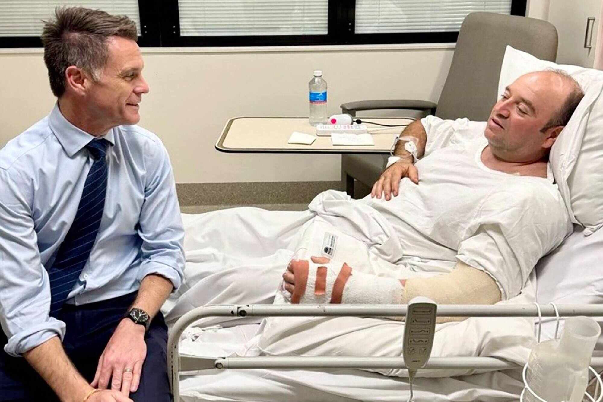 New South Wales Premier Chris Minns (left) speaking to Ahmed Al Ahmed, the man who tackled and disarmed one of the Bondi Beach attackers. Photo: AFP