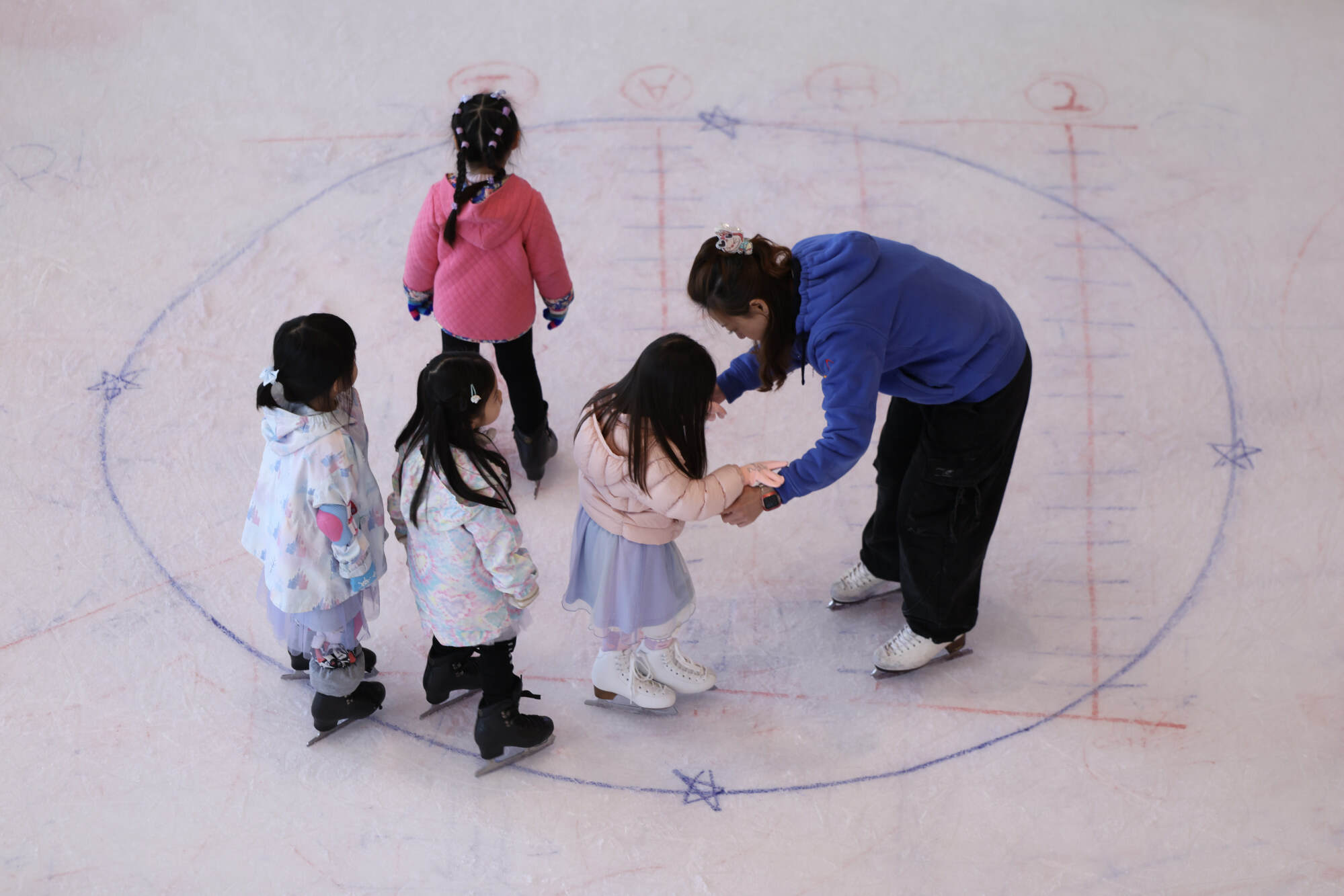 It might not be cold, but you can still get that frosty winter feeling at an indoor ice rink. Photo: Nora Tam
