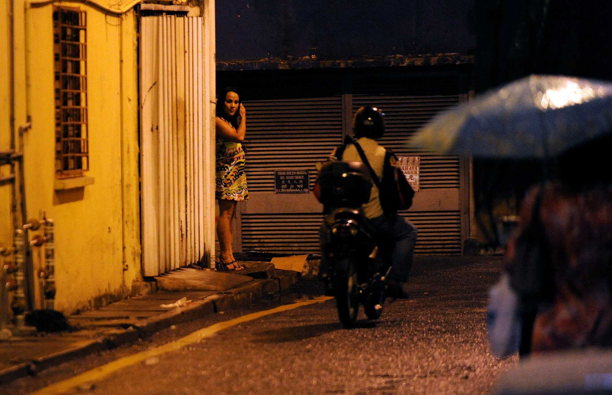 A Malaysian transgender sex worker waits for clients in Chow Kit, Kuala Lumpur, in 2009. Photo: AFP