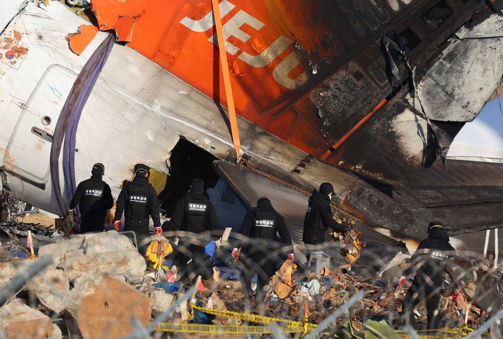 Forensic experts, police investigators and firefighters work at the site of the deadly plane crash at Muan International Airport. Photo: dpa