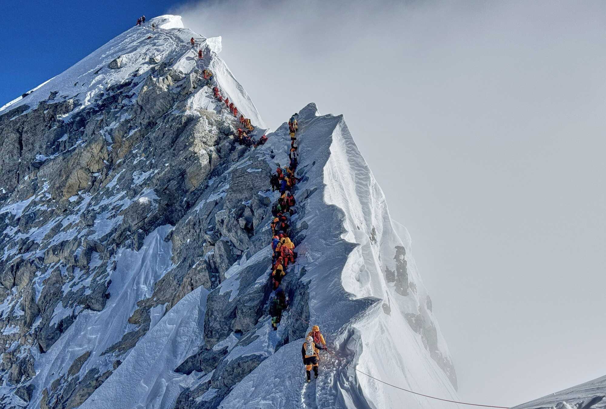 Climbers approach the summit of Mount Everest in Nepal in May. Nepal has unveiled a plan to curb waste left by climbers on the mountain and elsewhere in the Himalayas. Photo: AP