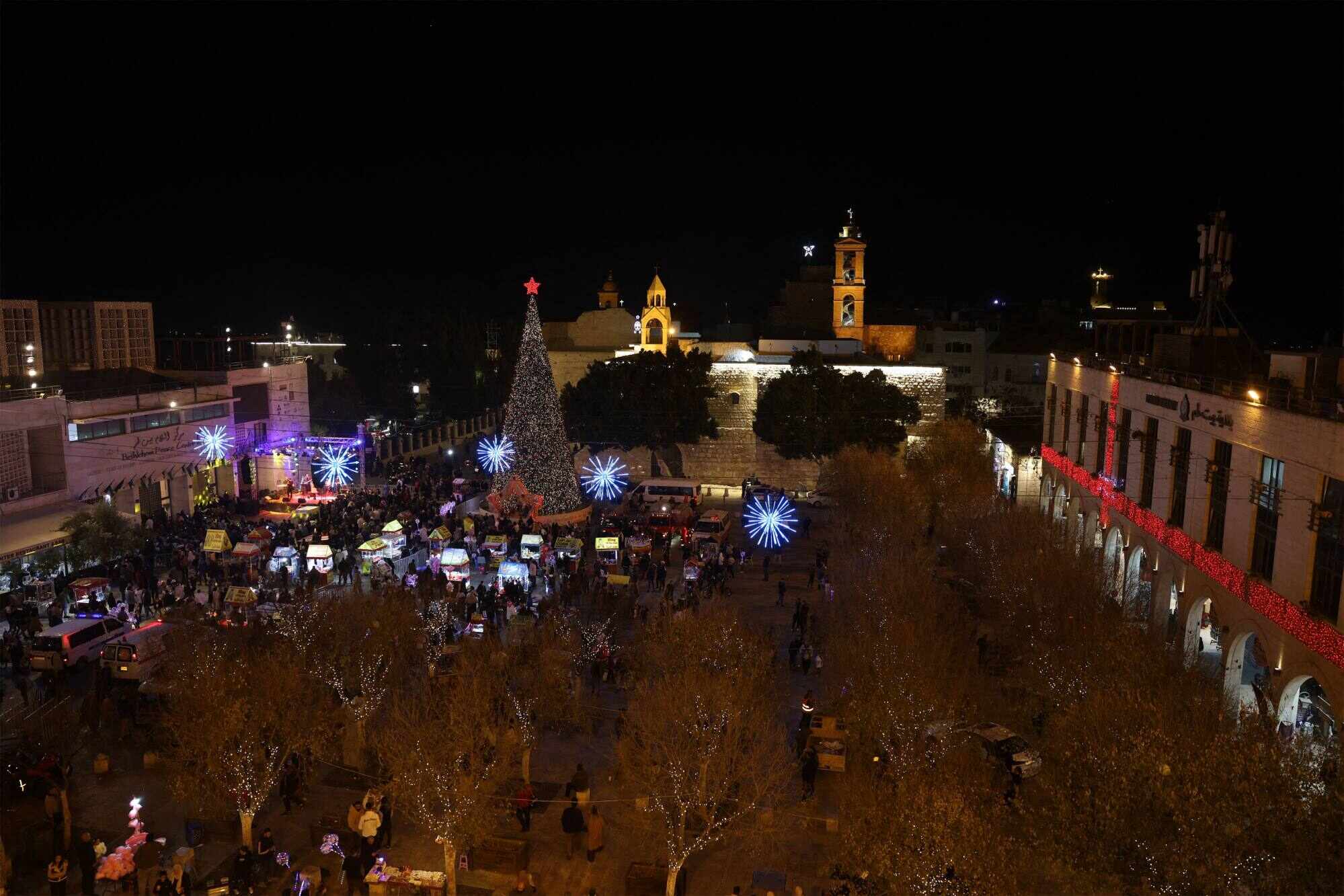 People gather to celebrate Christmas in Nativity Square before midnight mass at the Nativity Church in Bethlehem. Photo: AFP