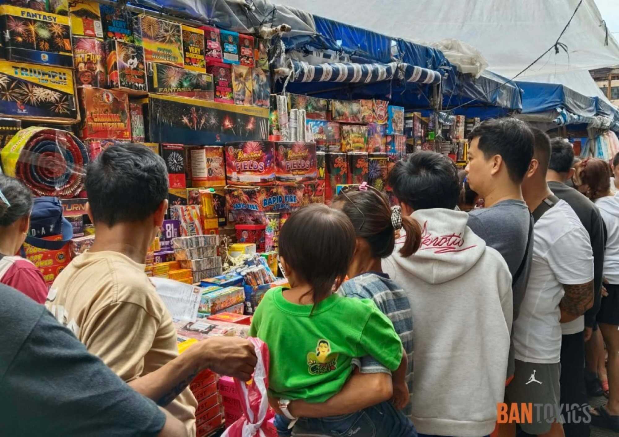 People look at firecrackers at a store in the Philippines. Every December 31, millions of Filipinos will set off a vast assortment of fireworks – many of them illegal and most of them dangerous. Photo: BAN Toxics