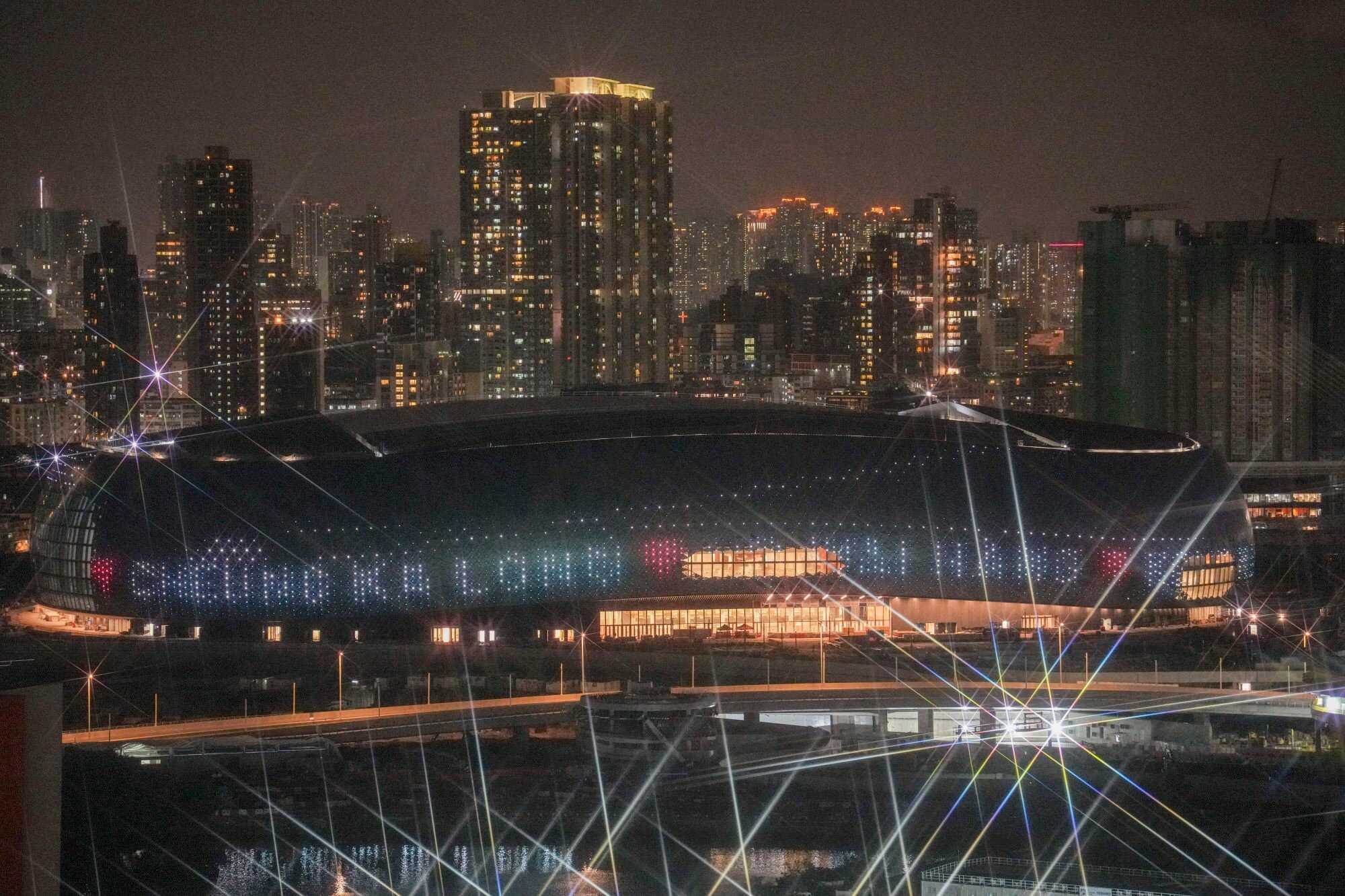 Kai Tak Sports Park displays Olympic wishes and the names of athletes on its exterior facade. Photo: Eugene Lee