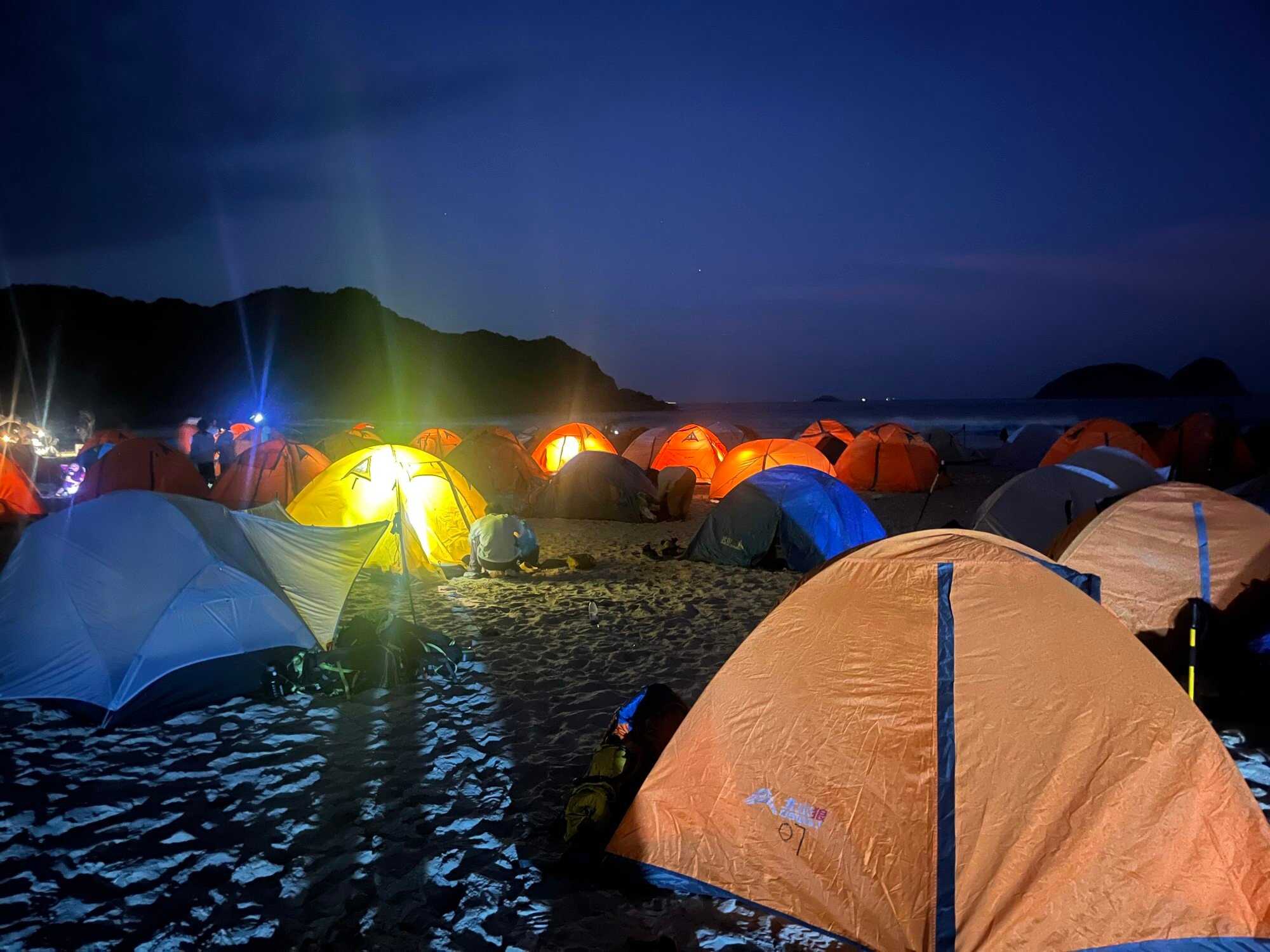 Visitors camp on Ham Tin beach, which has become a popular spot for tourists, especially from mainland China. Photo: Kelly Fung
