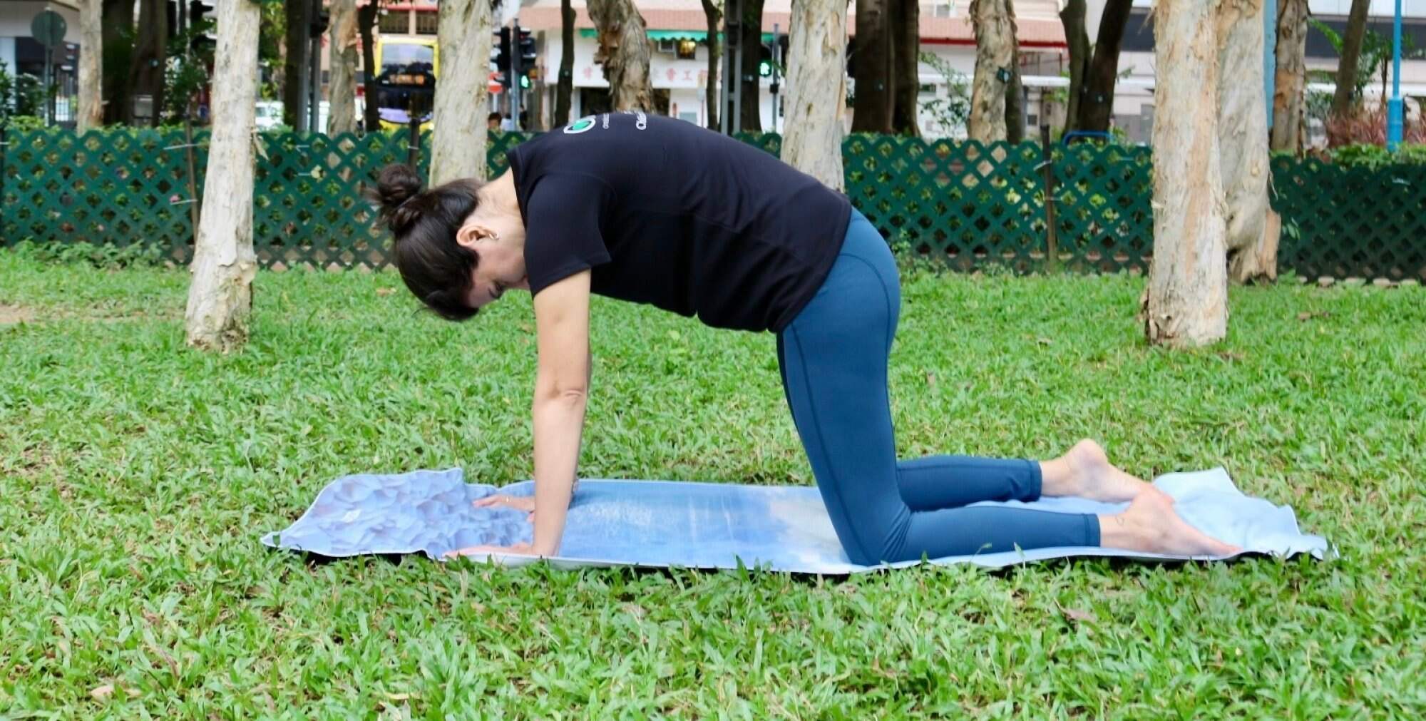 Arch your back for the cat pose, then lower your belly for the cow pose. Photo: Handout