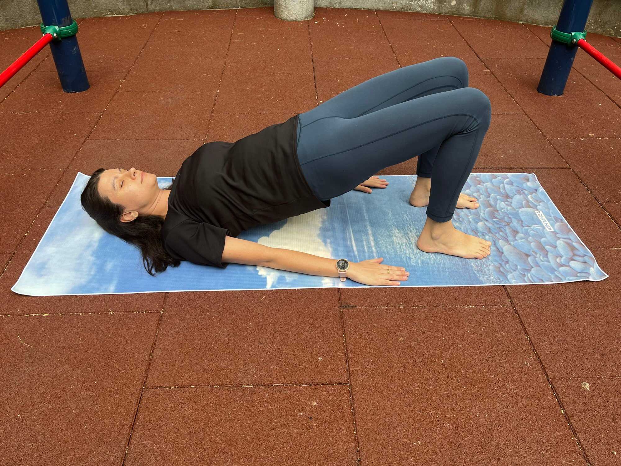 Hold your pelvis in the air while doing the bridge pose. Photo: Handout