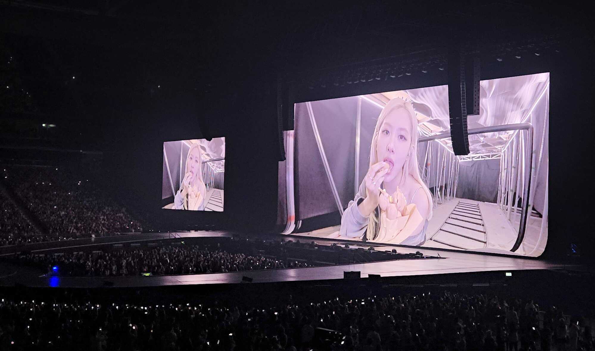 Blackpink member Rosé enjoys an egg waffle on camera during a break, maintaining the tradition of sampling local snacks throughout the world tour. Photo: Jess Ma