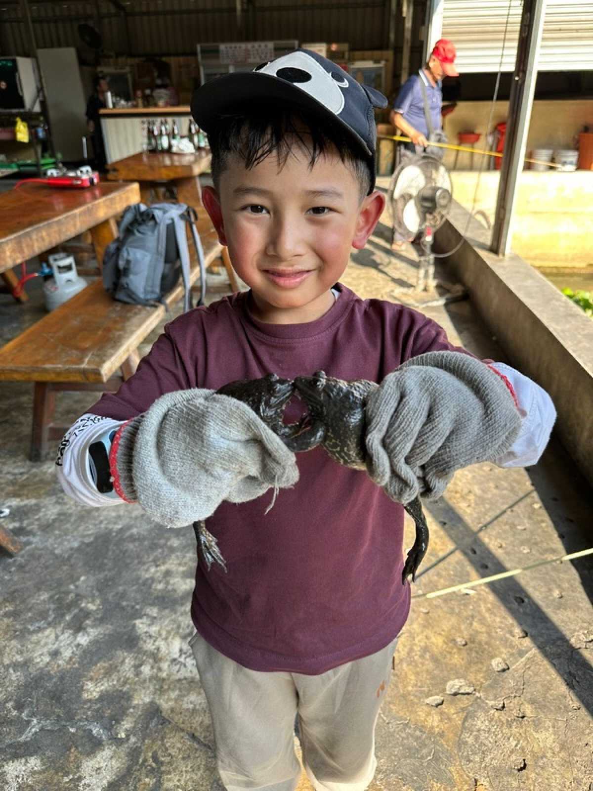 Davian Pradhan had fun fishing for toads in Taiwan. Photo: Handout
