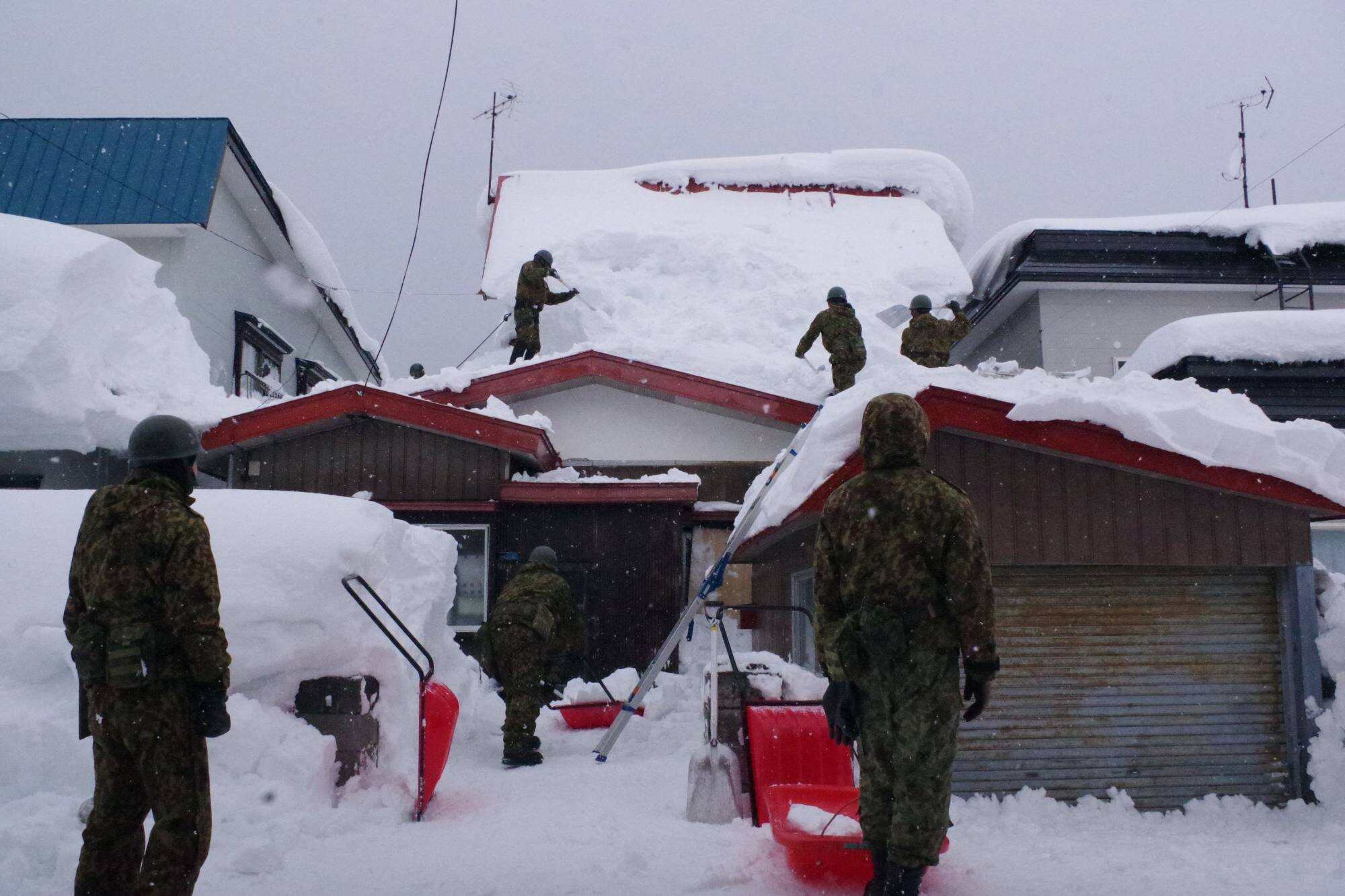 Members of the Japan Ground Self-Defence Force’s 5th Infantry Regiment, stationed in Aomori Prefecture, carry out snow removal work. Photo: Japan’s Ministry of Defence via AFP