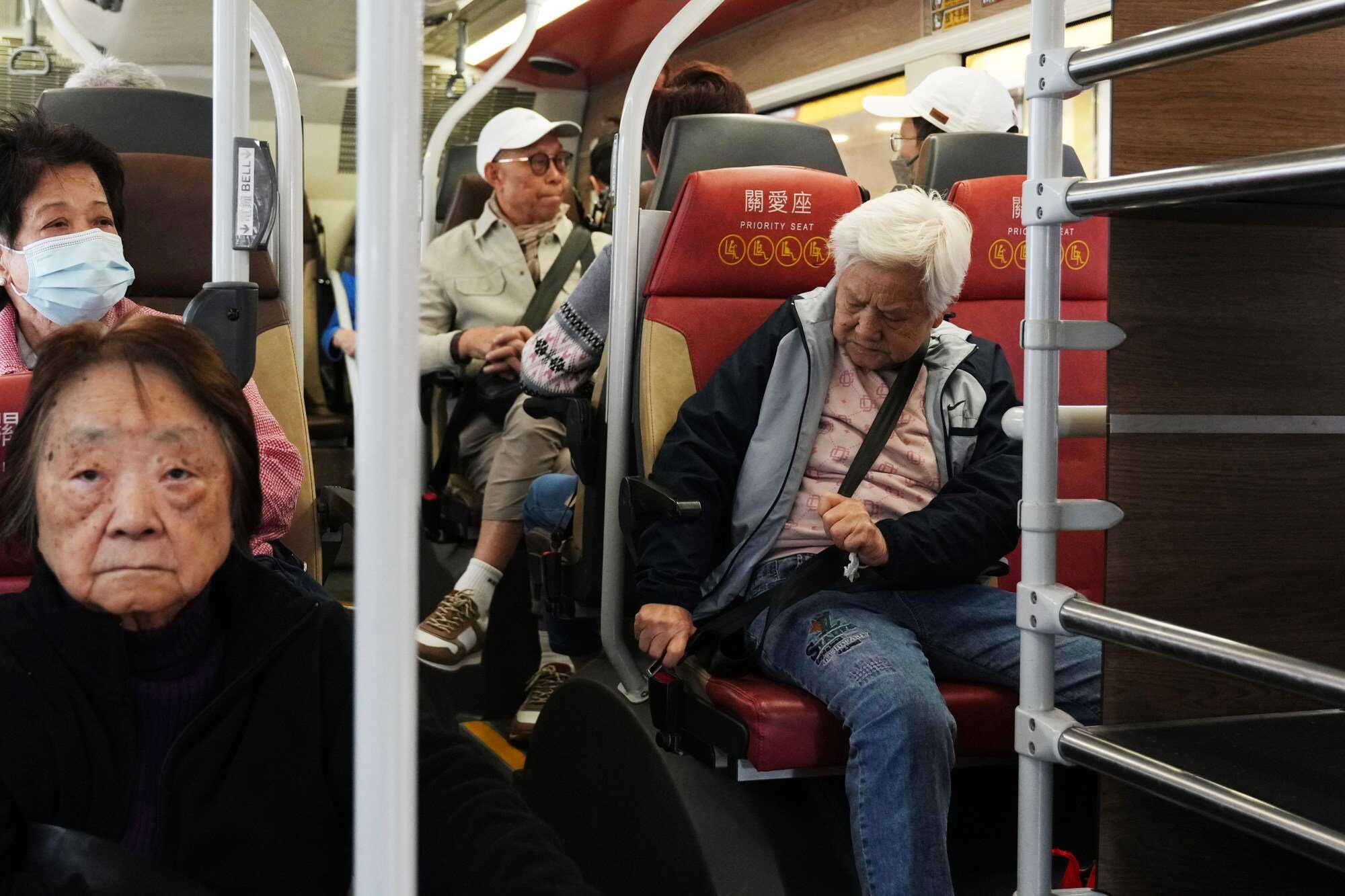 Passengers wear seat belts on a double-decker bus in Sham Shui Po. Photo: Sam Tsang