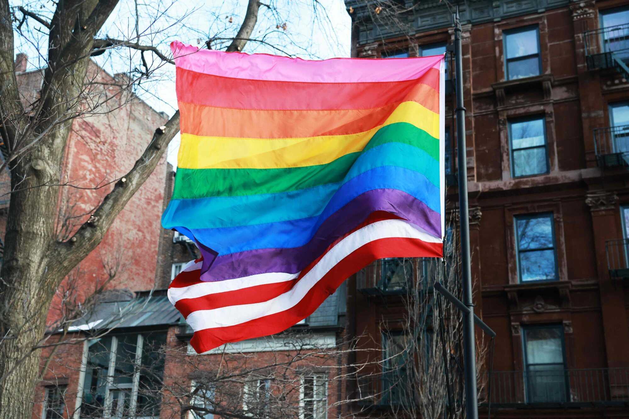 Local politicians and activists raised an LGBTQ Pride flag at the Stonewall National Monument on February 12, 2026, in New York City, after the Trump administration had the National Park Service remove it earlier in the week. Photo: Getty Images via AFP
