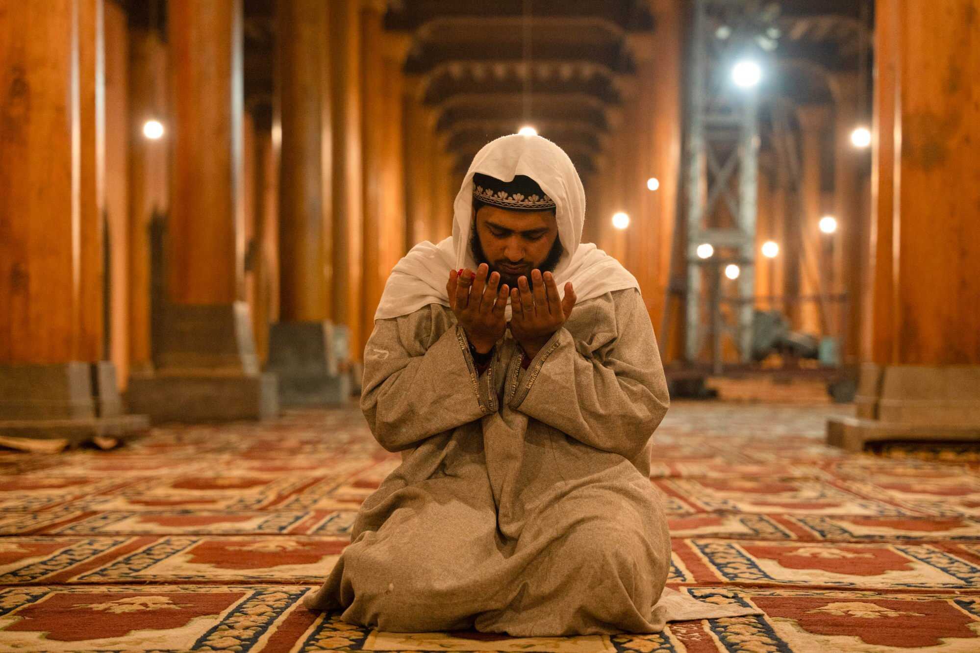 A man prays after performing the first Tarawih ritual prayers at the Jamia Masjid, or Kashmir’s Grand Mosque, in Srinagar, marking the start of the holy month of Ramadan. Photo: dpa