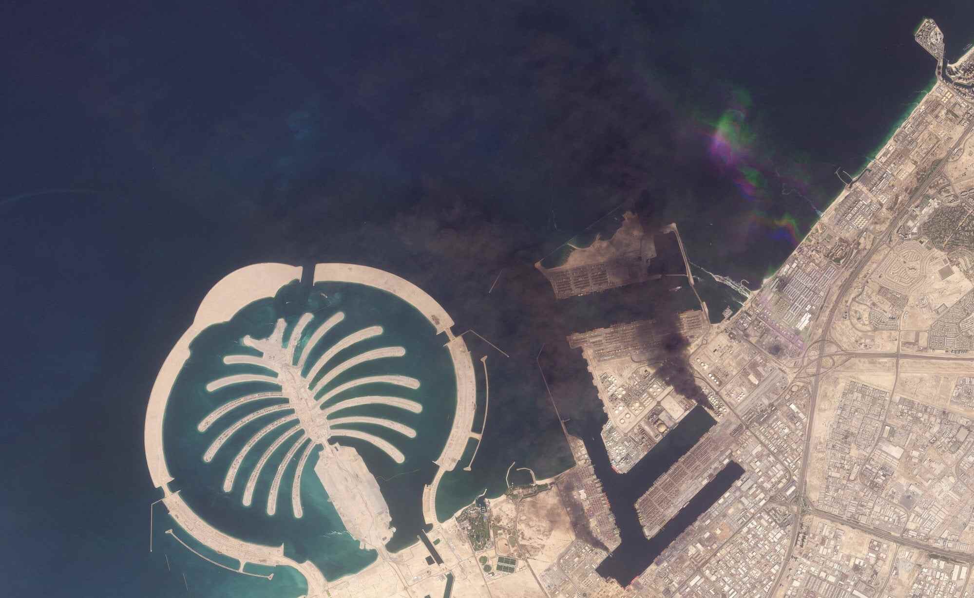 A satellite image of Jebel Ali Port in Dubai, United Arab Emirates after one of the berths caught fire because of debris from an intercepted missile on March 1, 2026. Photo: Planet Labs PBC/Handout via Reuters