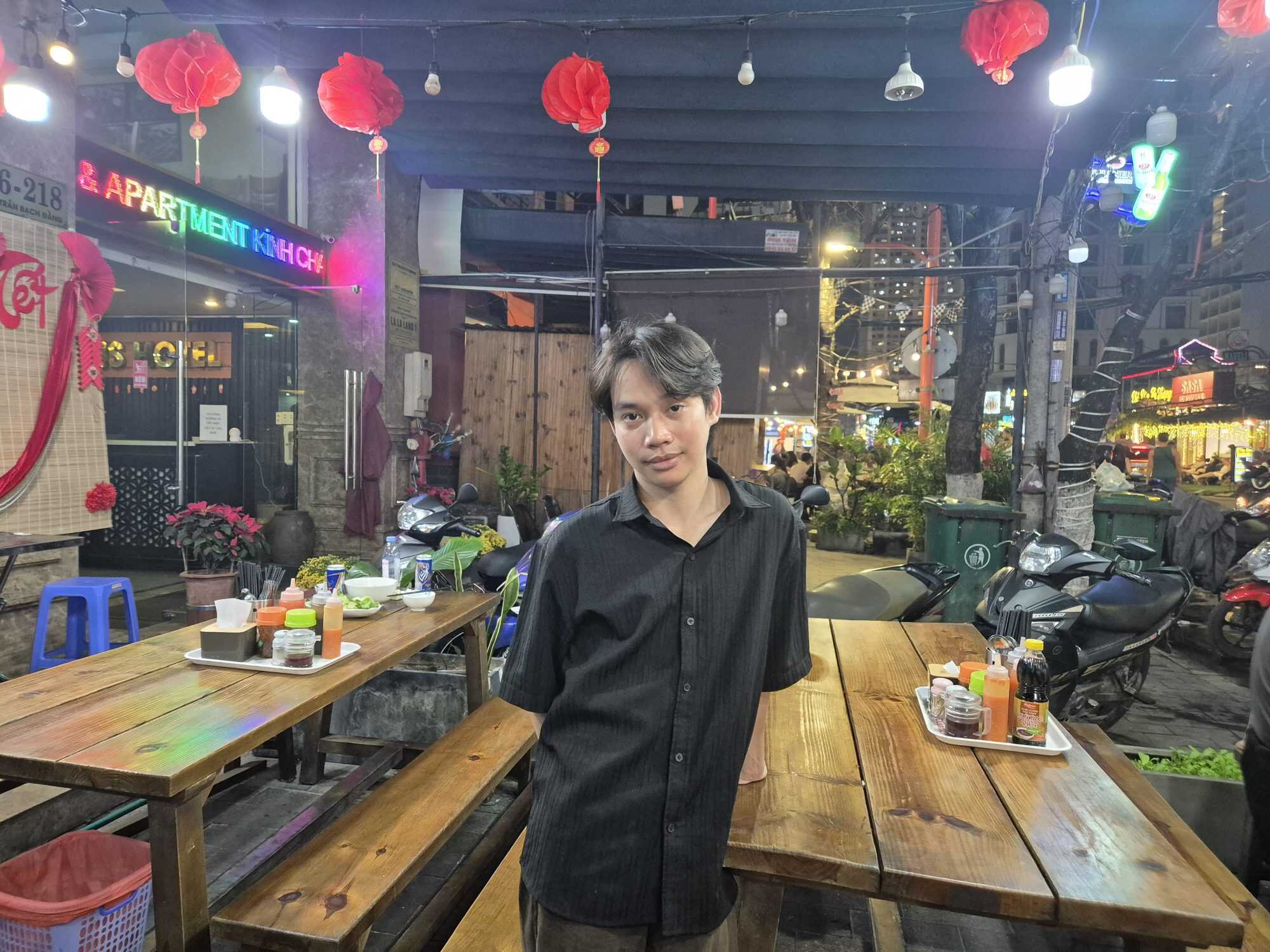 Van Chin, 28, works at a restaurant in a popular night market in Da Nang where many of his customers are South Korean. Photo: David D. Lee