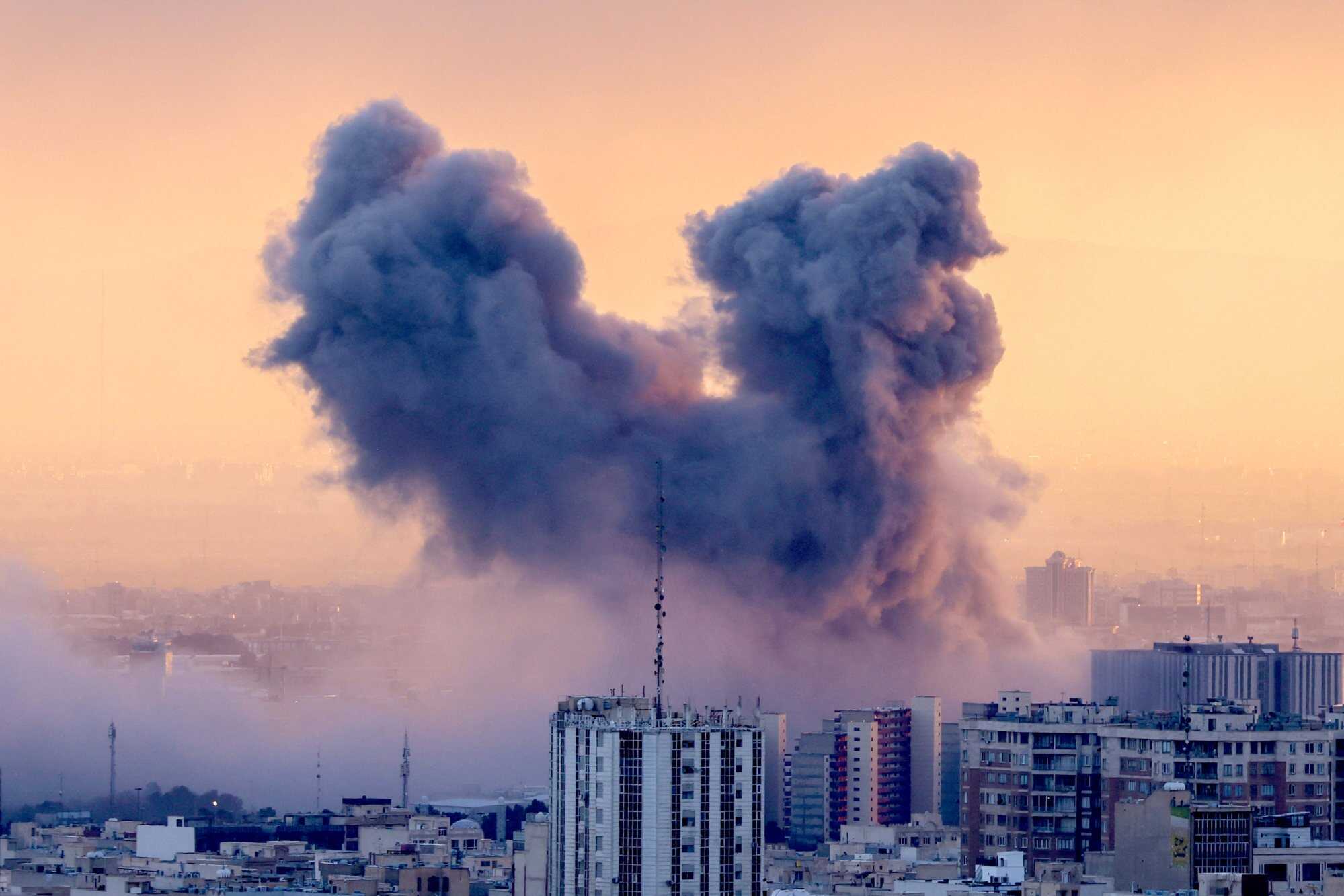 A plume of smoke rises after a strike on the Iranian capital Tehran, on March 3, 2026. Photo: AFP/Getty Images/TNS