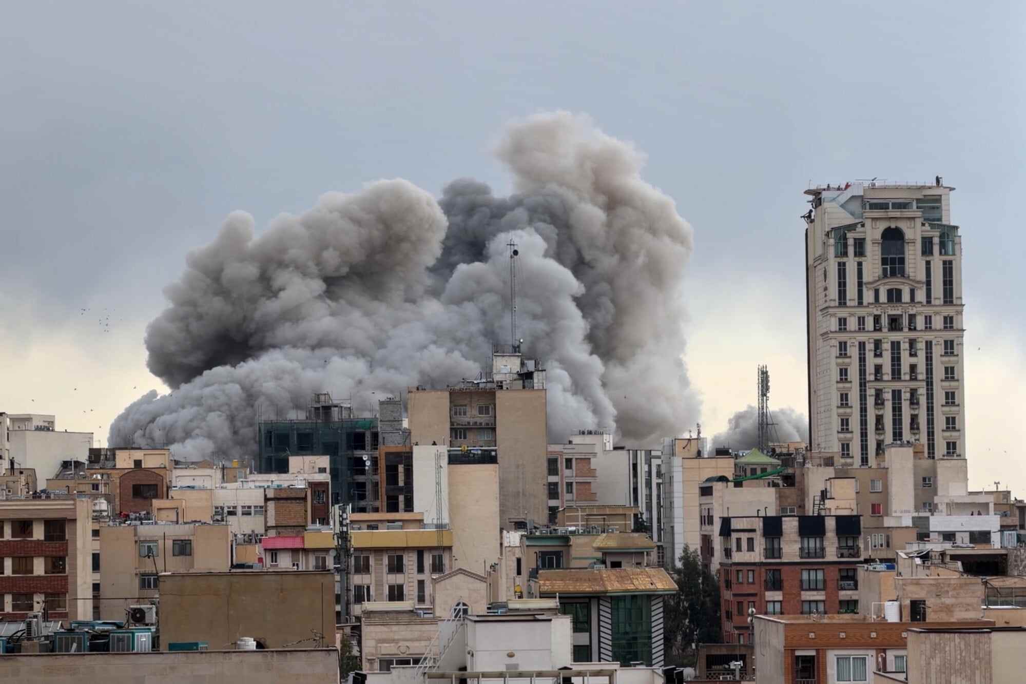 A plume of smoke rises after a strike in Tehran on Monday, March 2, 2026. Photo: AP