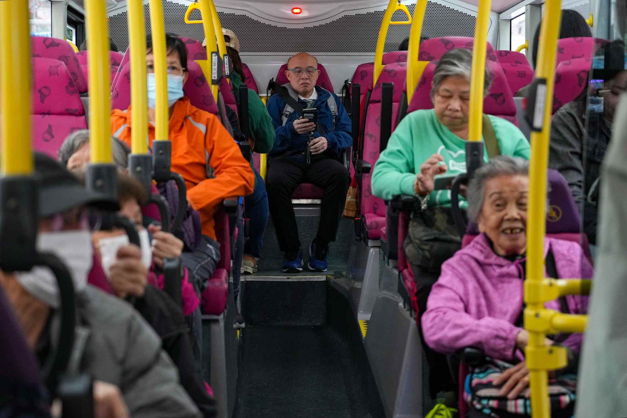 Passengers on a double-decker bus in Sham Shui Po. Elderly residents currently enjoy a flat fare of HK$2 on public transport. Photo: Sam Tsang