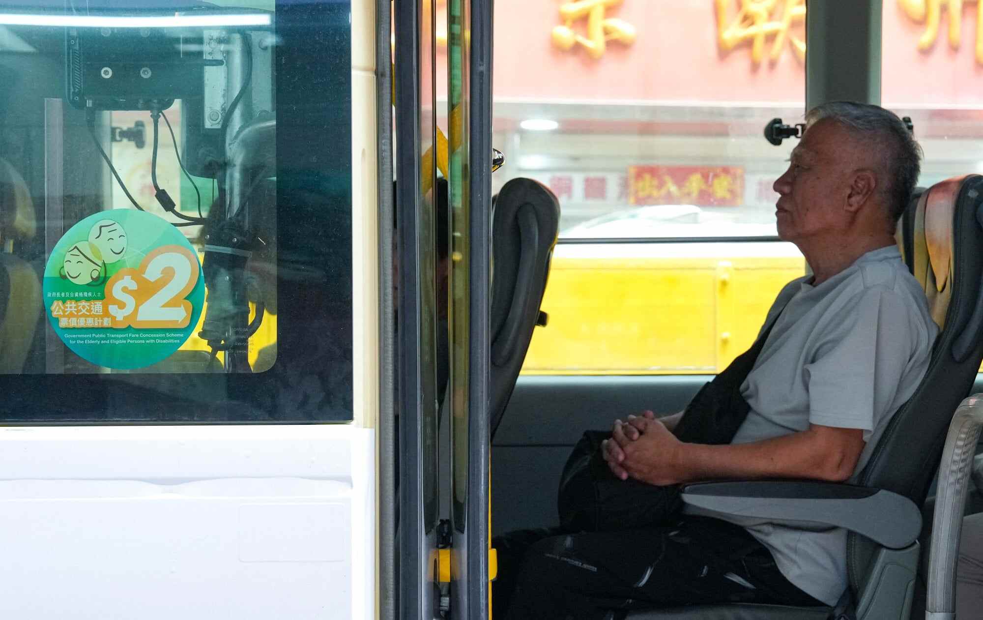 Under the updated policy, beneficiaries will only enjoy the HK$2 flat rate for journeys where the standard adult fare is HK$10 or less. Photo: Jelly Tse